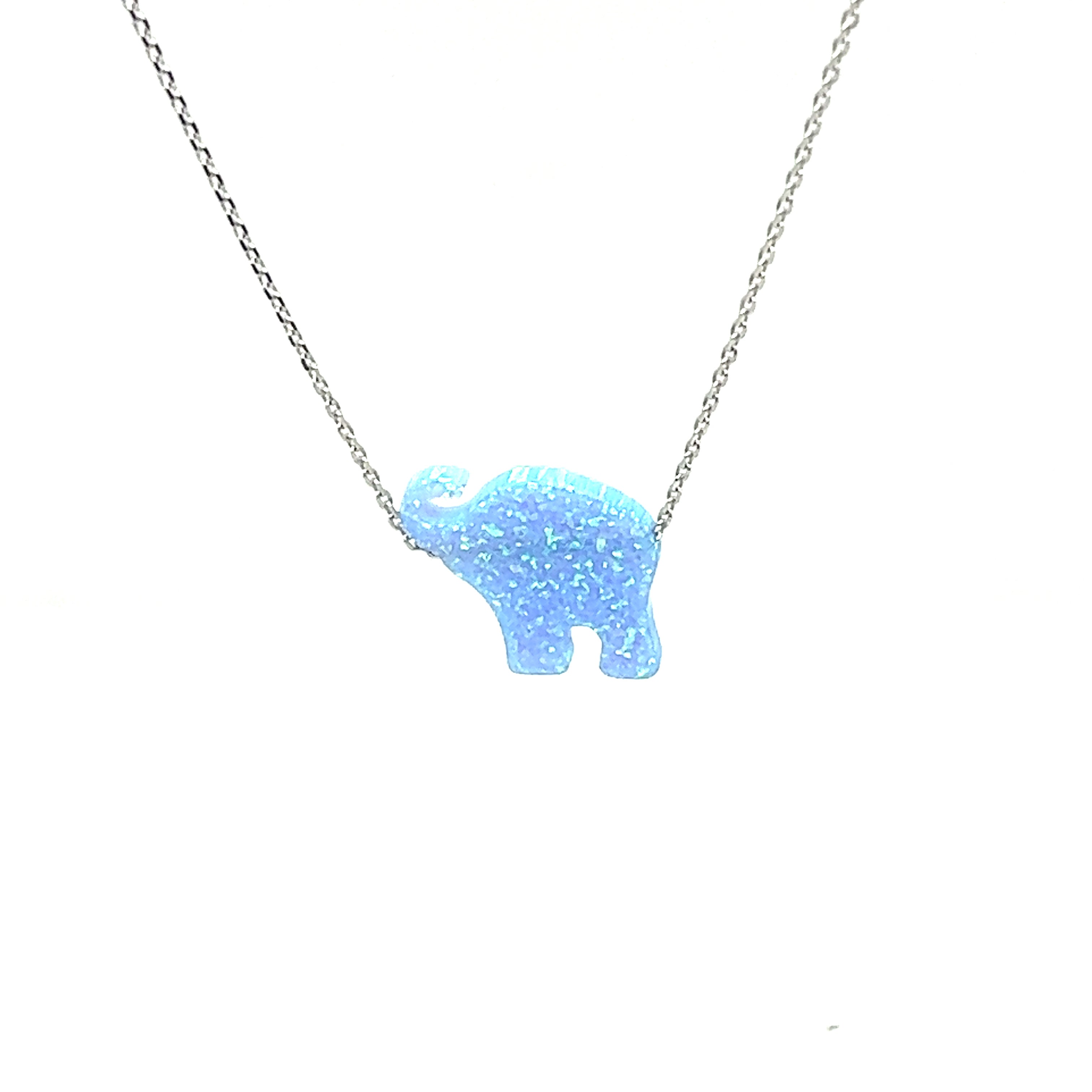 A Super Silver Blue Opal Elephant Necklace with a boho vibe, featuring a striking ocean blue stone.