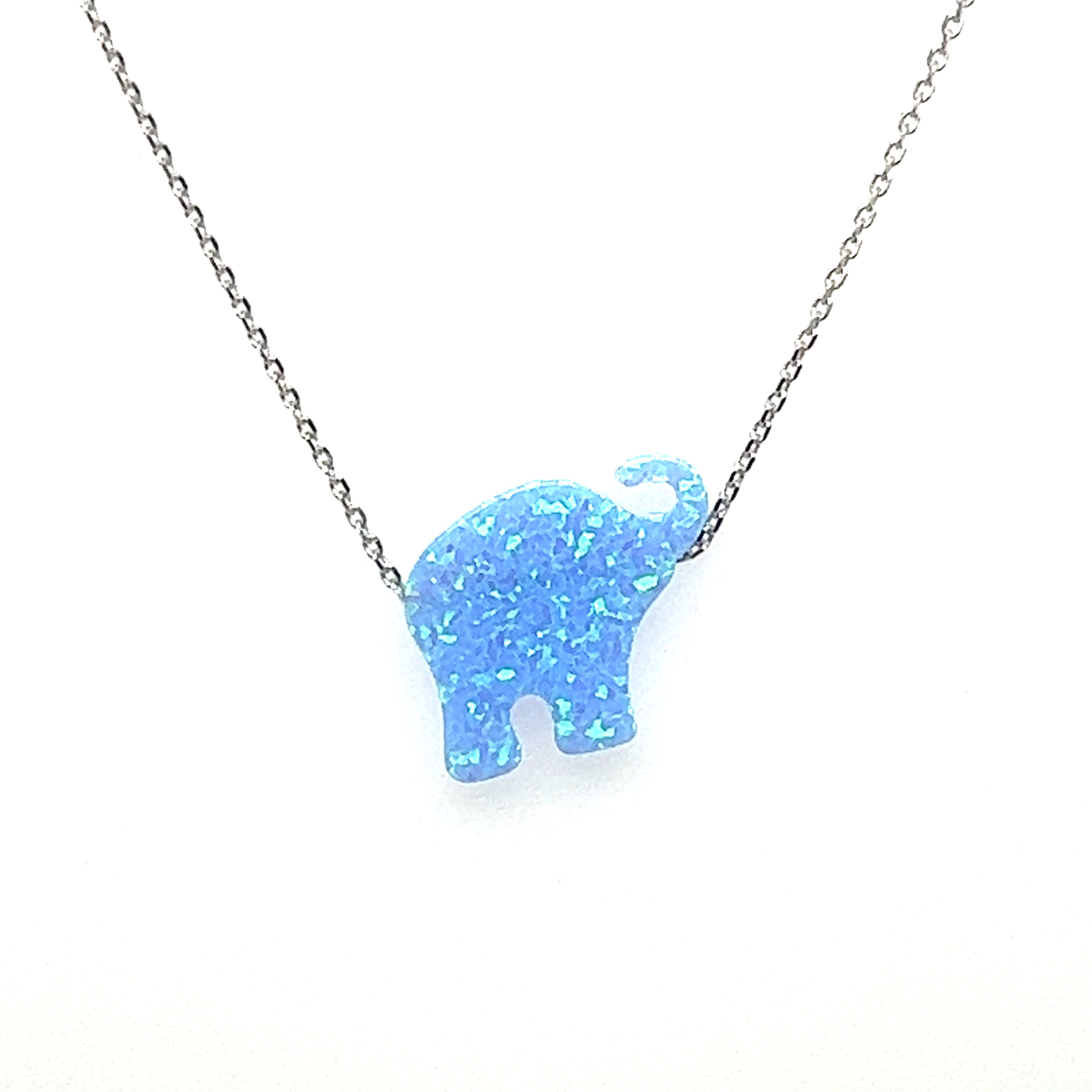 A Super Silver Blue Opal Elephant Necklace with a boho vibe on a chain.