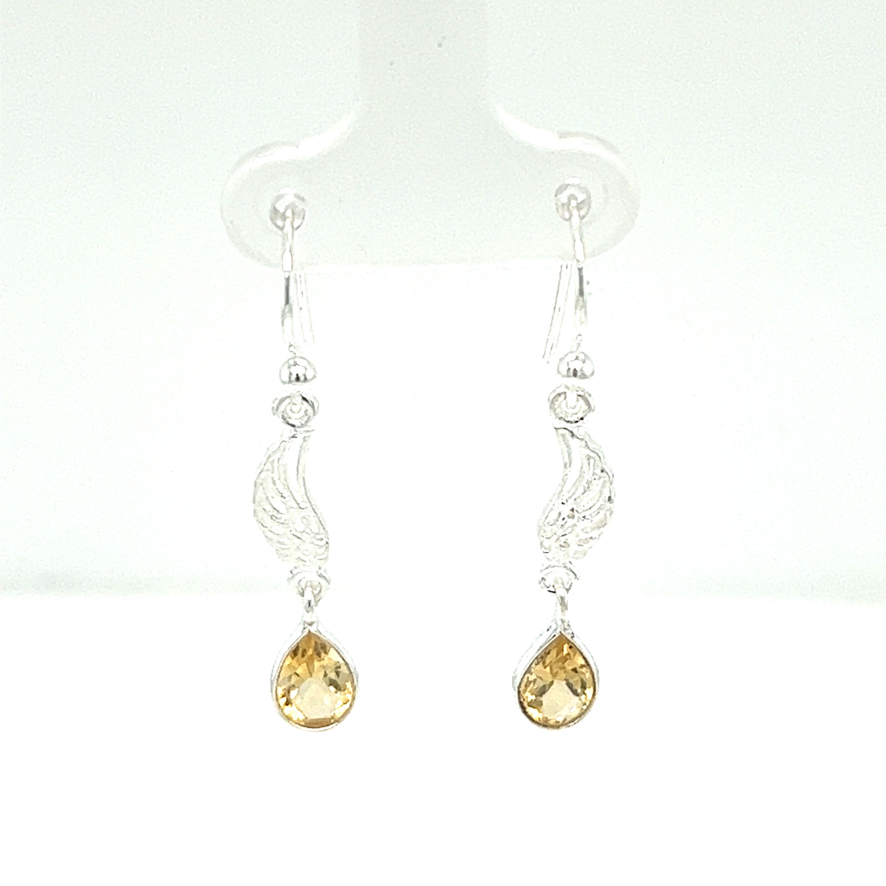 A pair of Super Silver angel wing earrings with citrine stones.