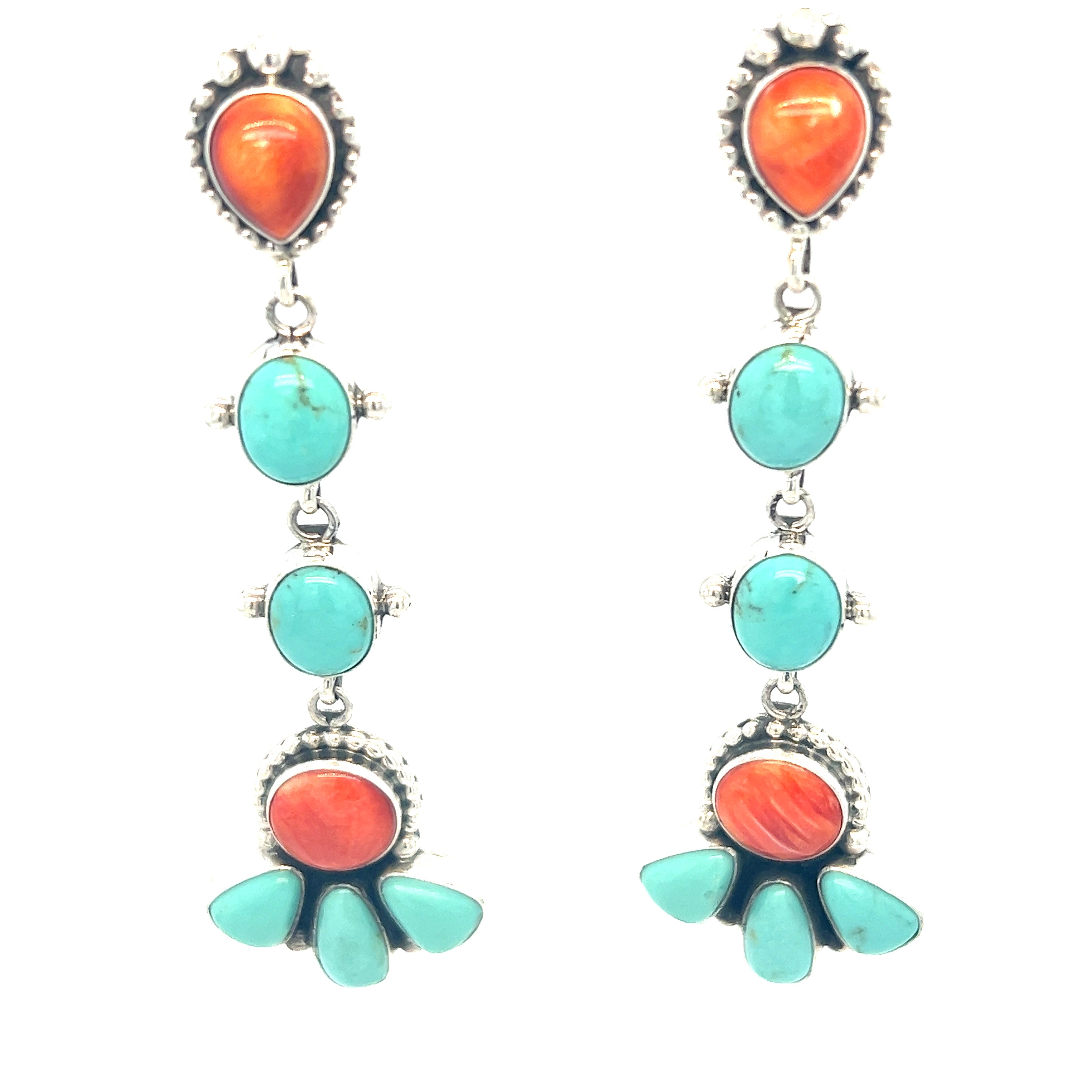Super Silver's Handcrafted Statement Turquoise and Shell Earrings, featuring turquoise and orange stones, are Southwest-inspired.