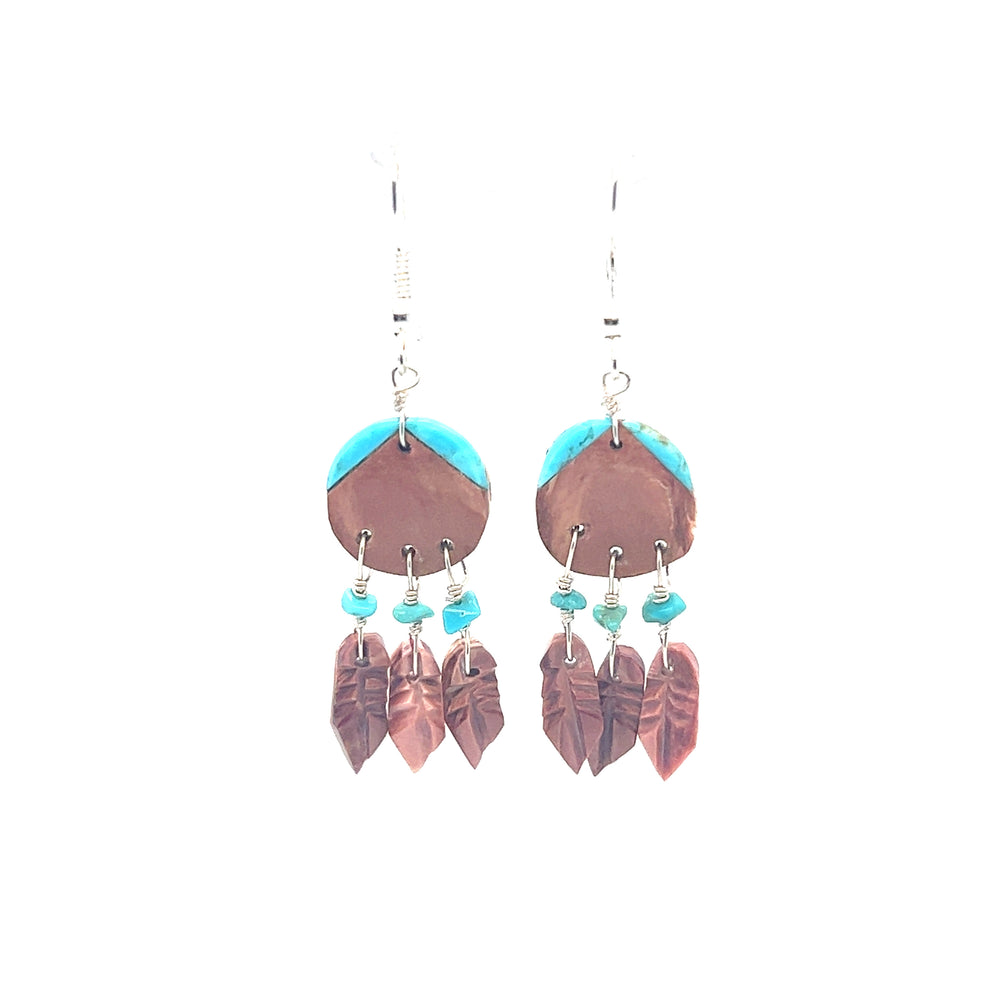 
                  
                    A pair of Handmade Earrings with 3 Small Stone Feathers adorned with feathers, reflecting the artistry of Native American culture by Super Silver.
                  
                
