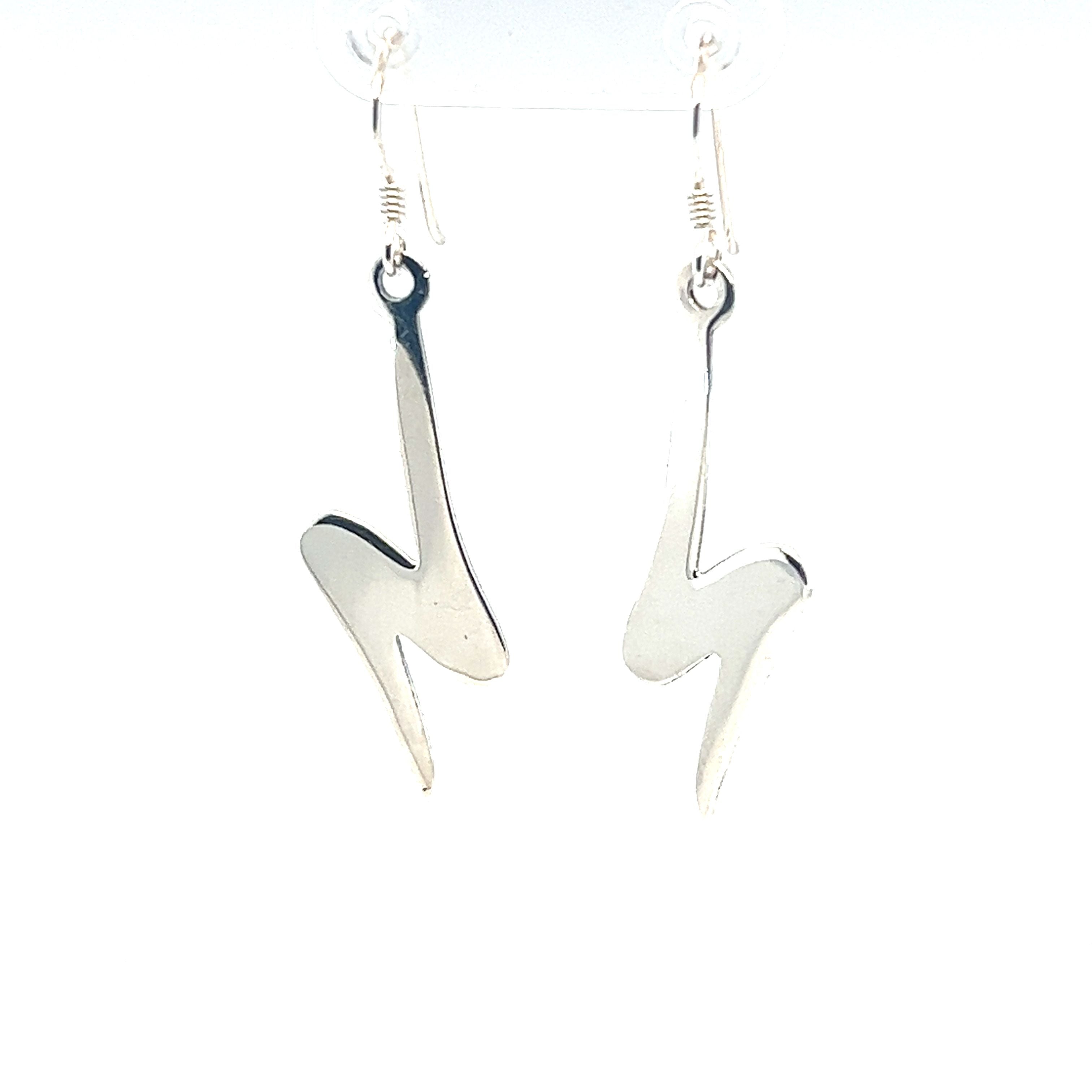 A pair of chic Super Silver silver lightning bolt earrings on a white background.