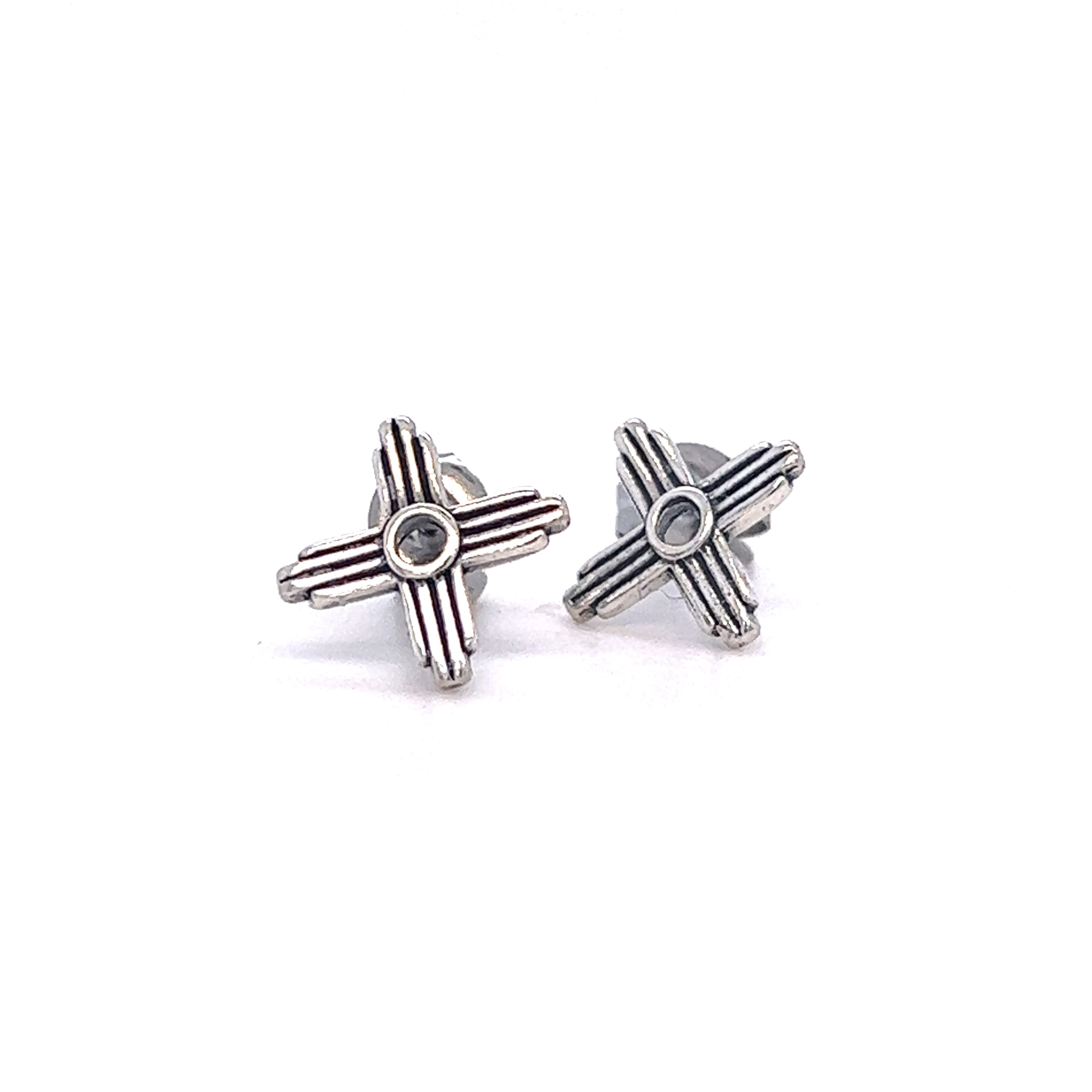 A pair of silver Super Silver Zia Sun Stud earrings.