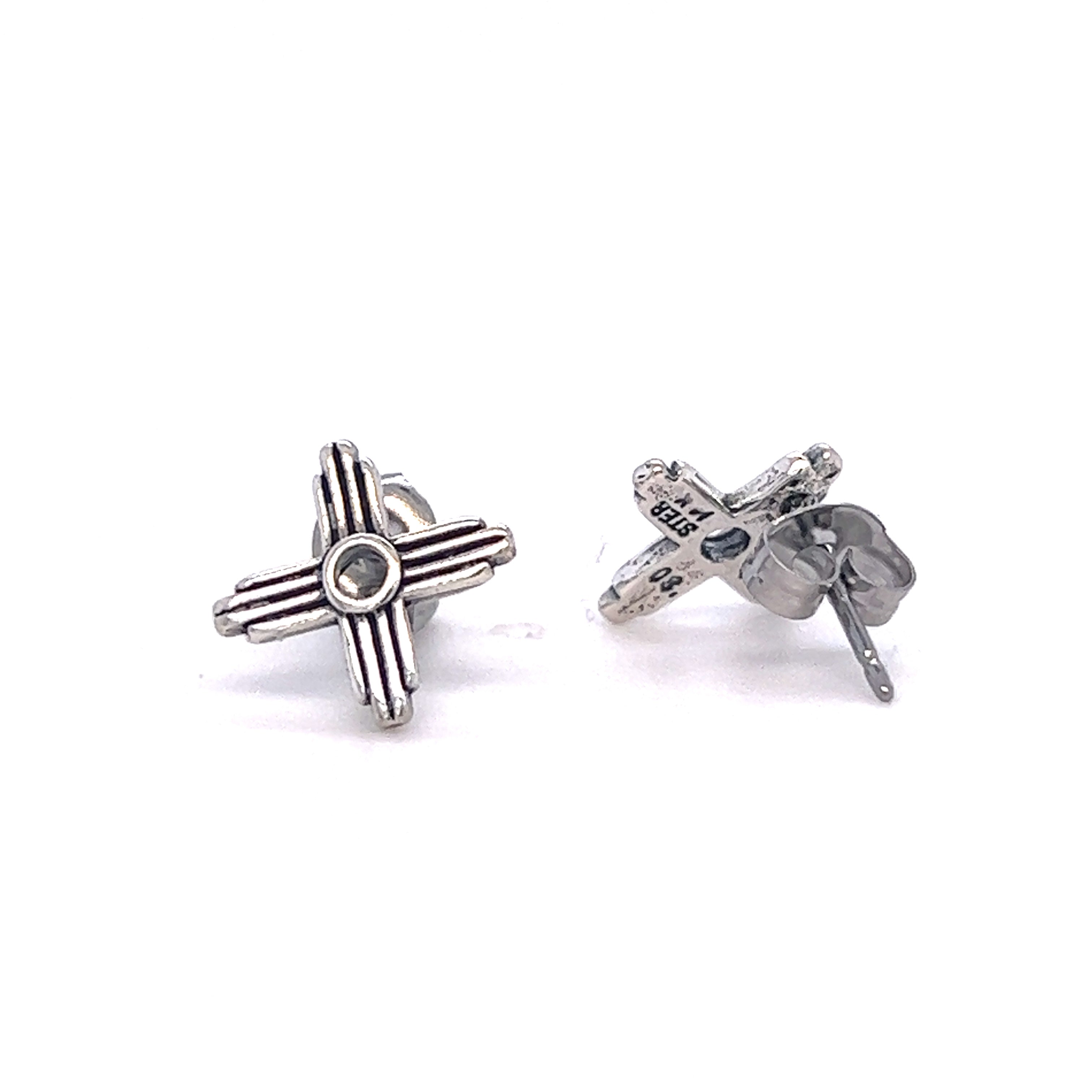 A pair of Super Silver Zia Sun Studs with a cross design, adding symbolism to the simplistic elegance.