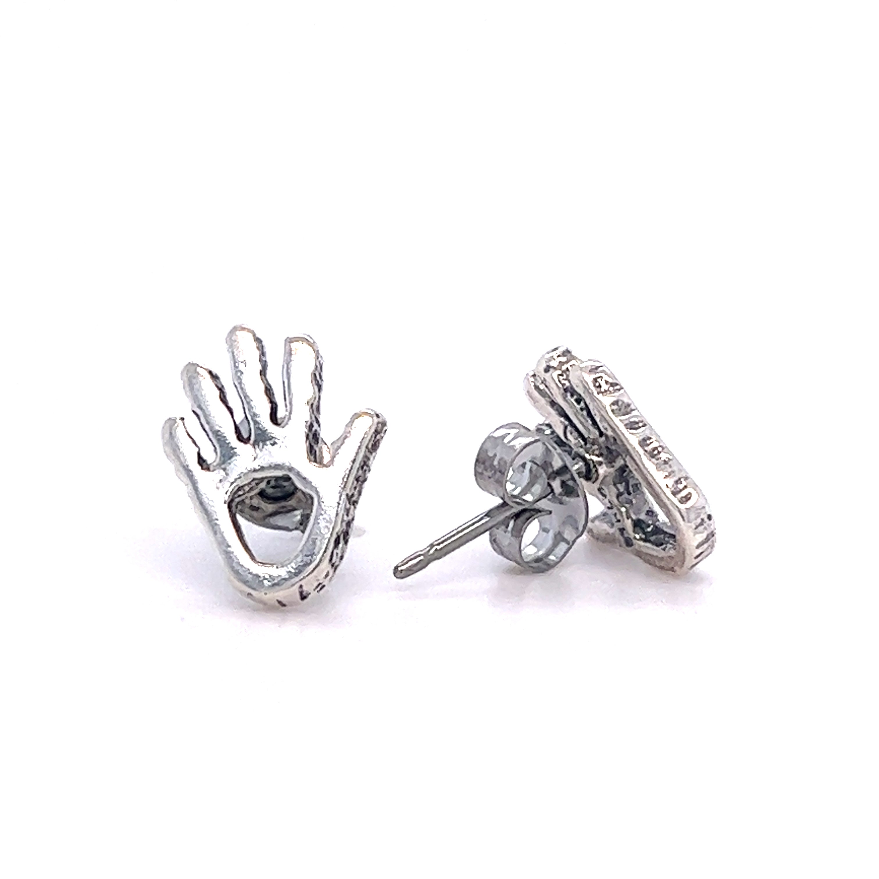 A pair of Super Silver Petroglyph Hand Studs.