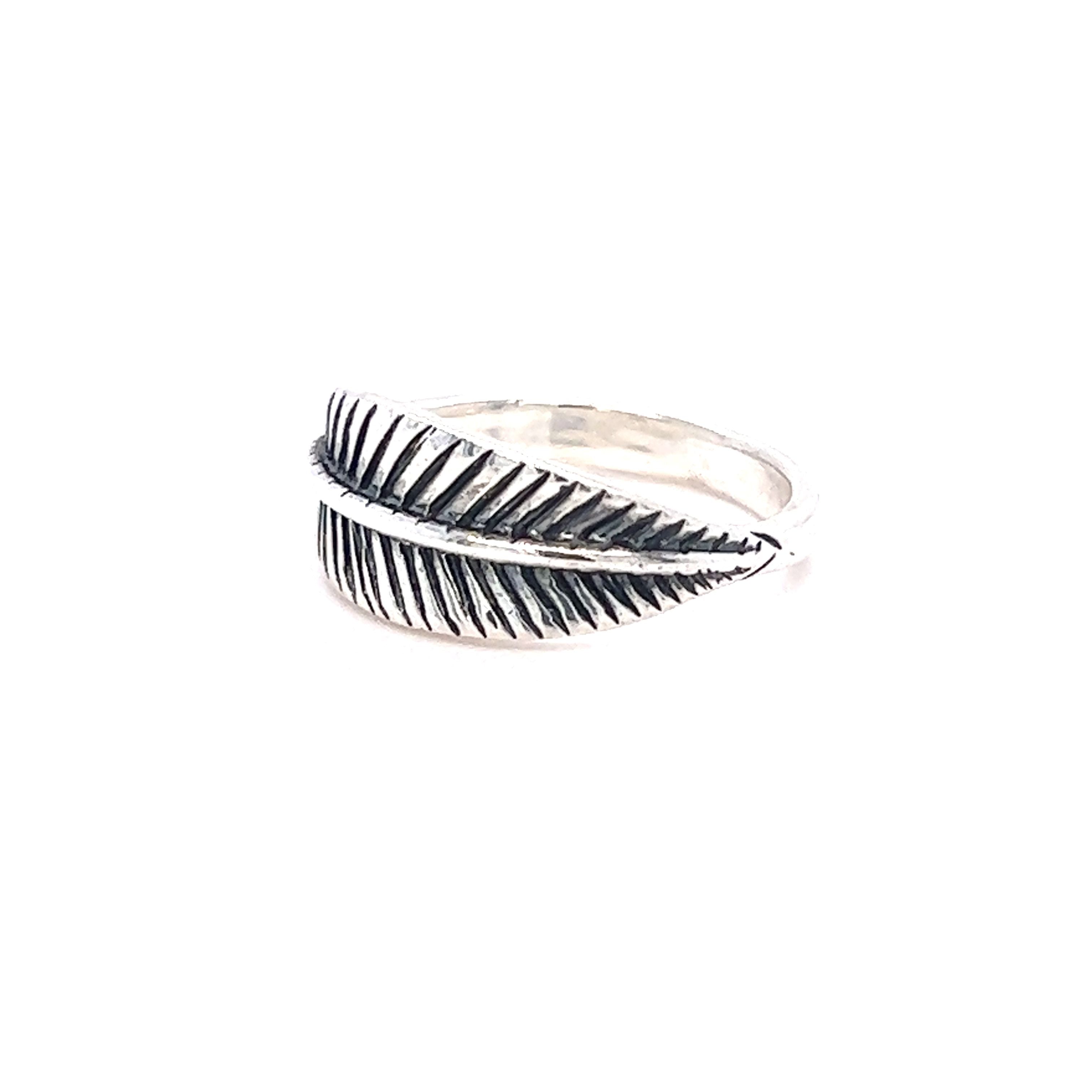A Super Silver Oxidized Feather Ring with a leaf design featuring boho-chic charm.