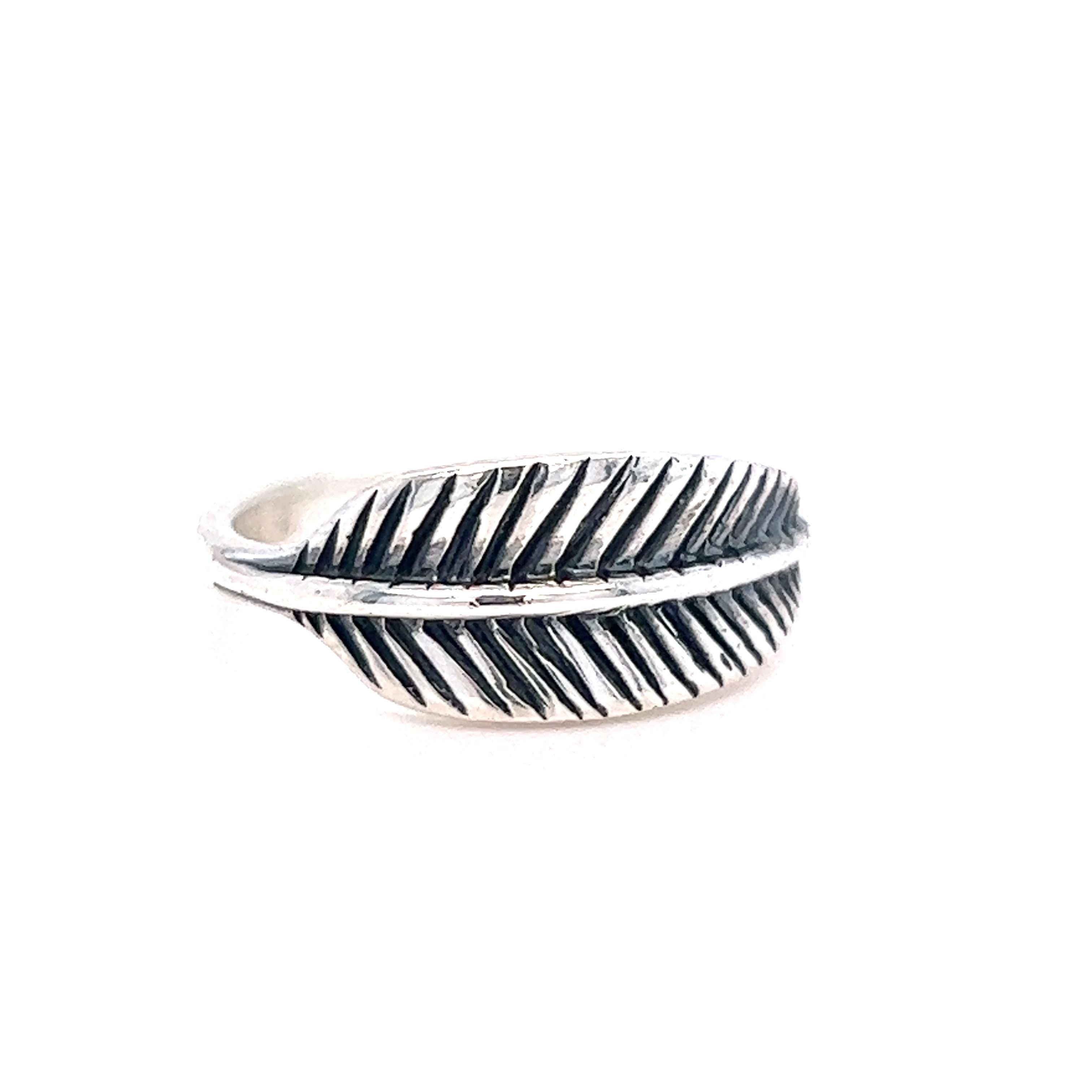 A southwestern-inspired Super Silver Oxidized Feather Ring with boho-chic charm.