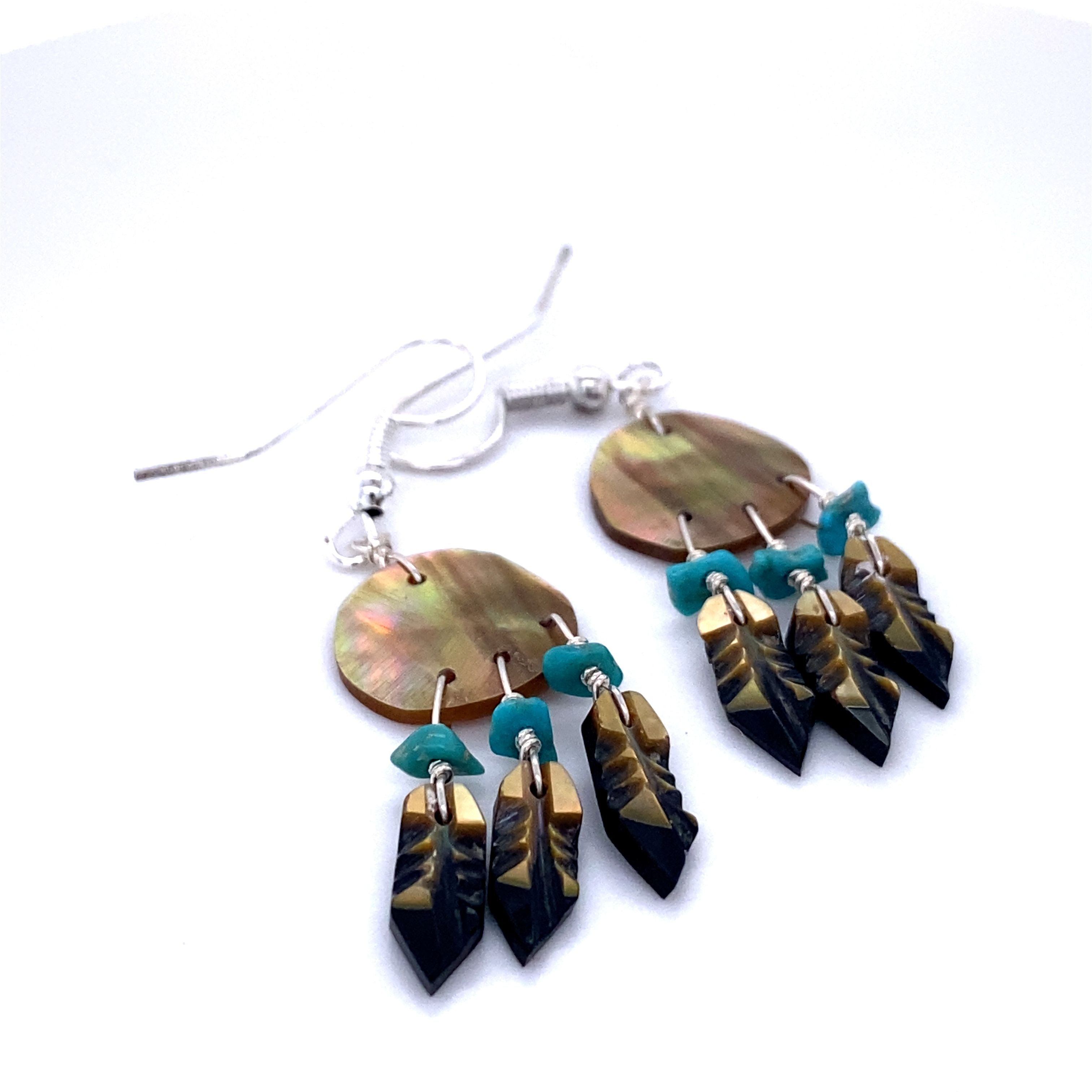 Super Silver's Artisan-made earrings with turquoise and black natural stone beads, inspired by Native American culture are replaced with Super Silver's Handmade Earrings with 3 Small Stone Feathers.