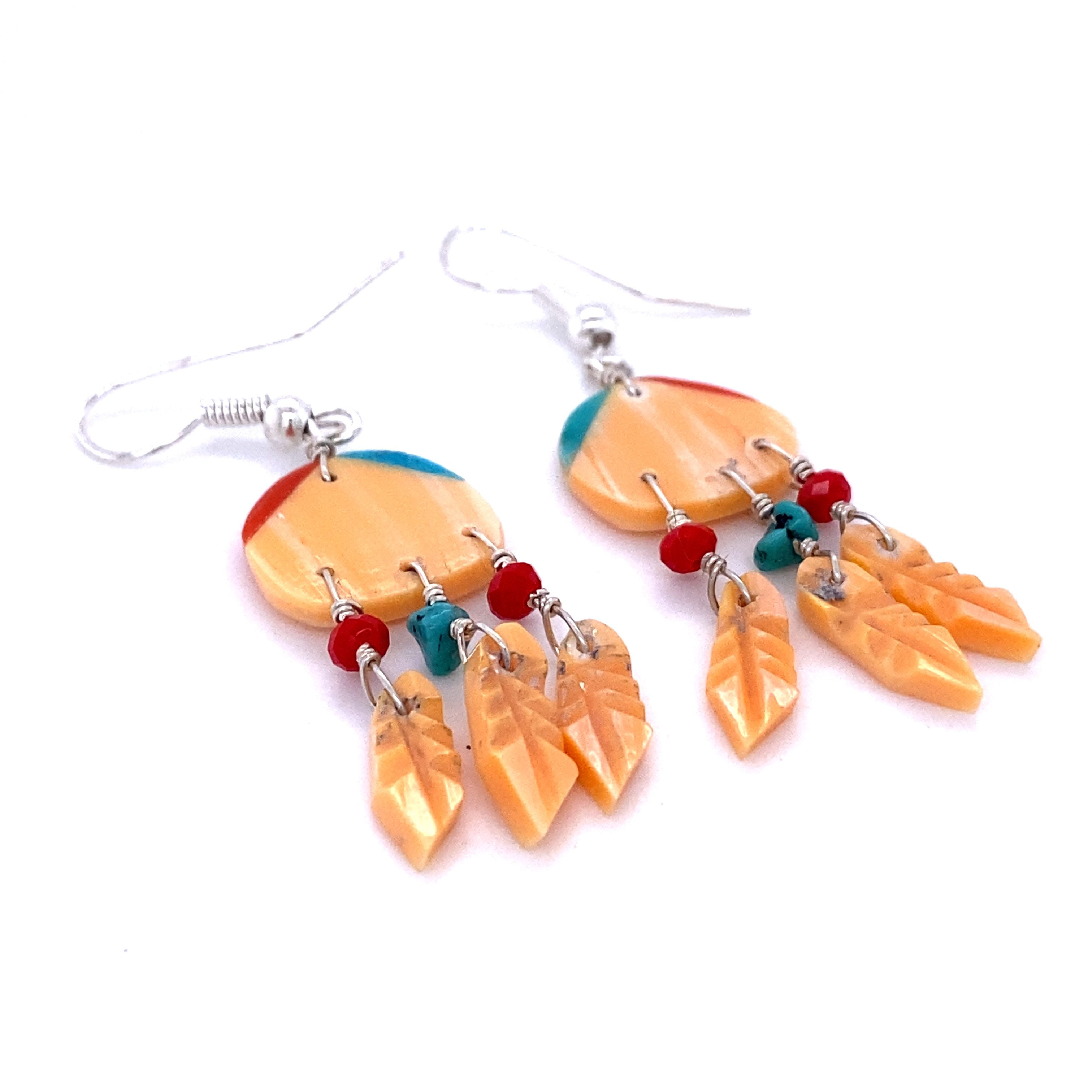 A pair of vibrant Super Silver dream catcher earrings, handcrafted by skilled artisans using inspiration from Native American culture. These unique earrings feature beautiful natural stone accents with 3 Small Stone Feathers.