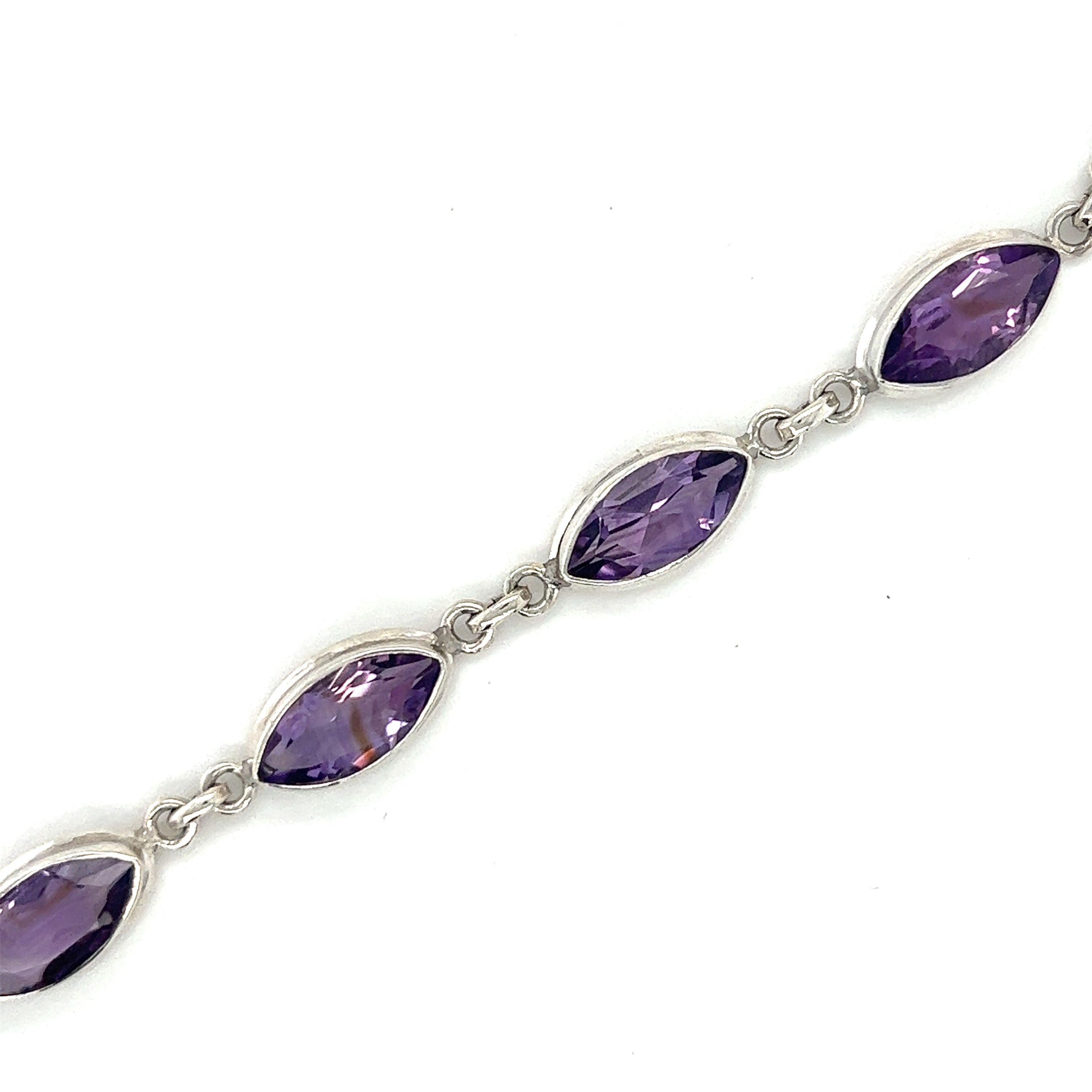 A Stunning Amethyst Marquise Shaped Bracelet by Super Silver, radiating creativity on a white background.