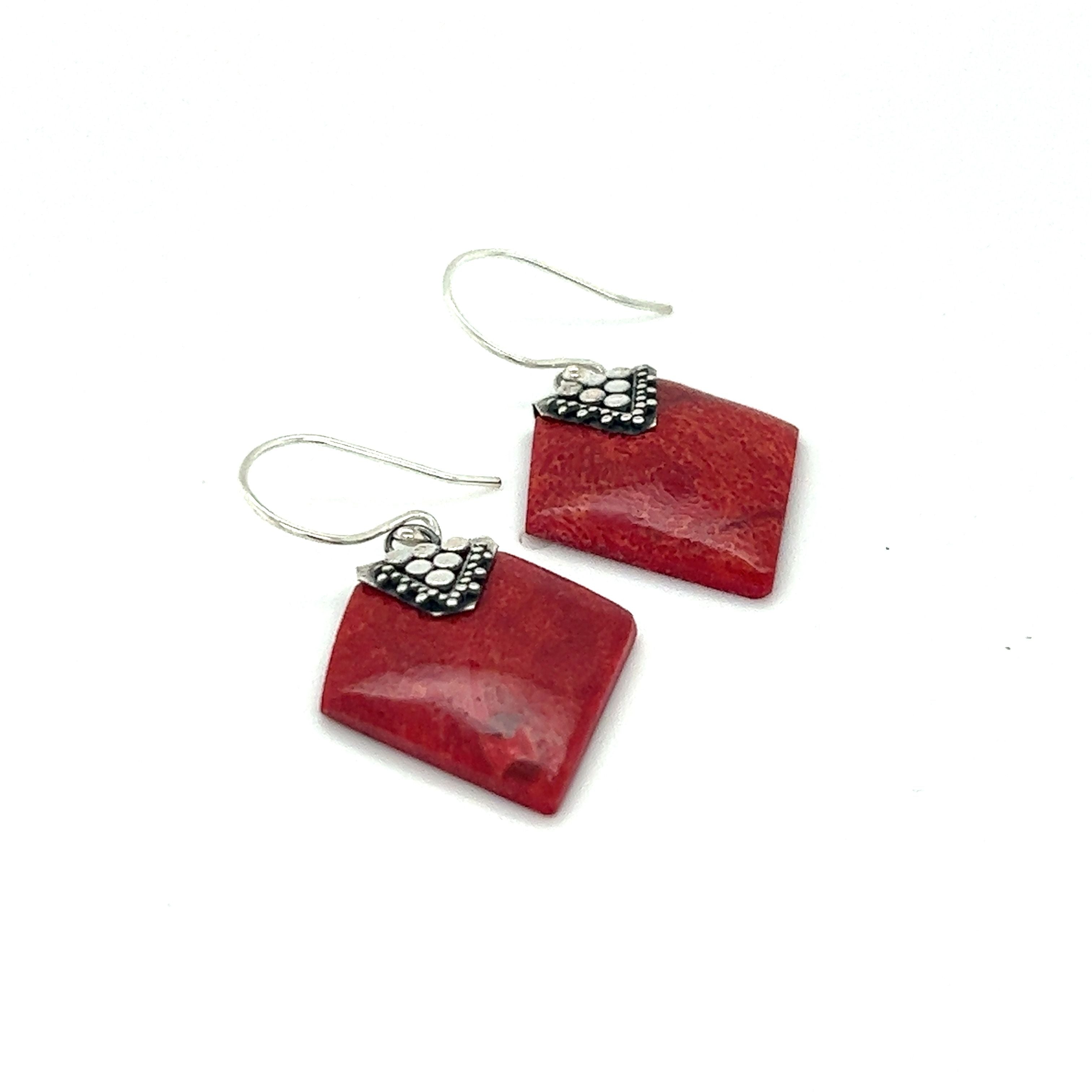 A pair of Sponge Coral Diamond Earrings with Super Silver accents featuring Bali design and .925 Sterling Silver.