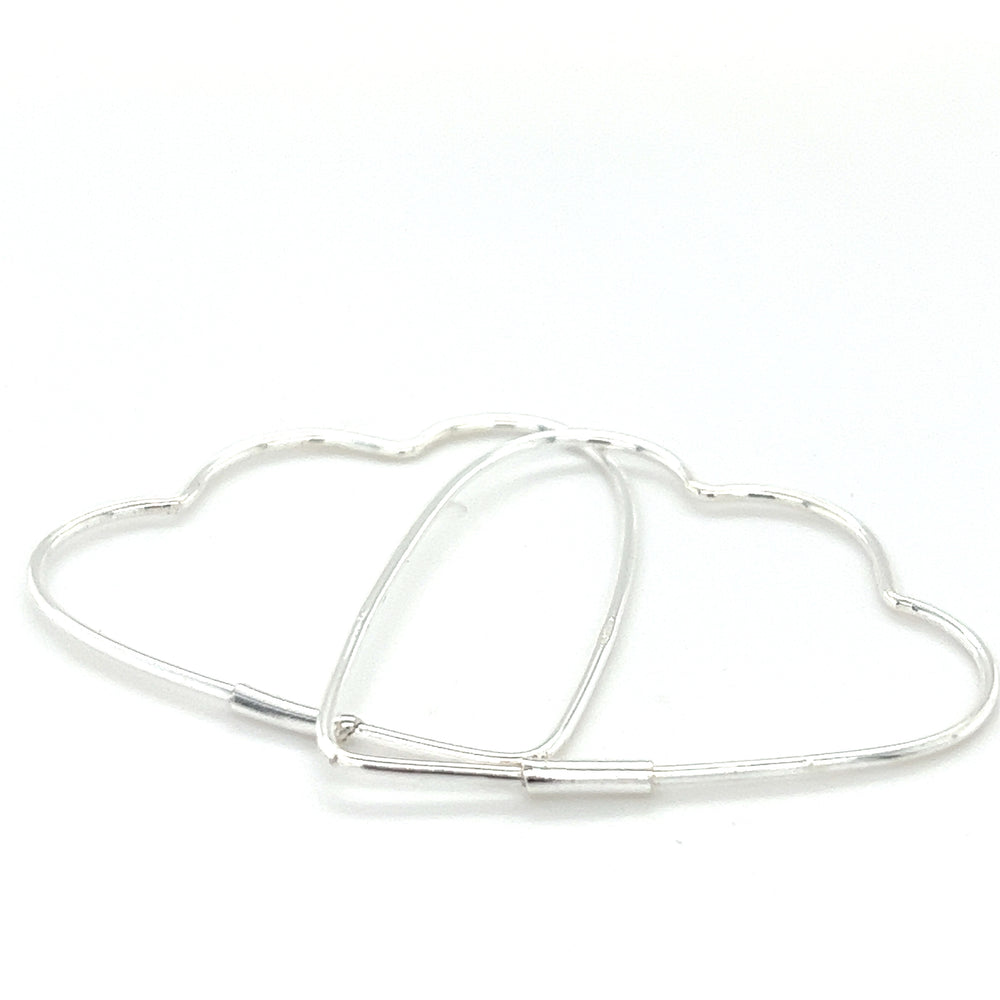 A pair of Delicate Heart Shaped Hoops by Super Silver.