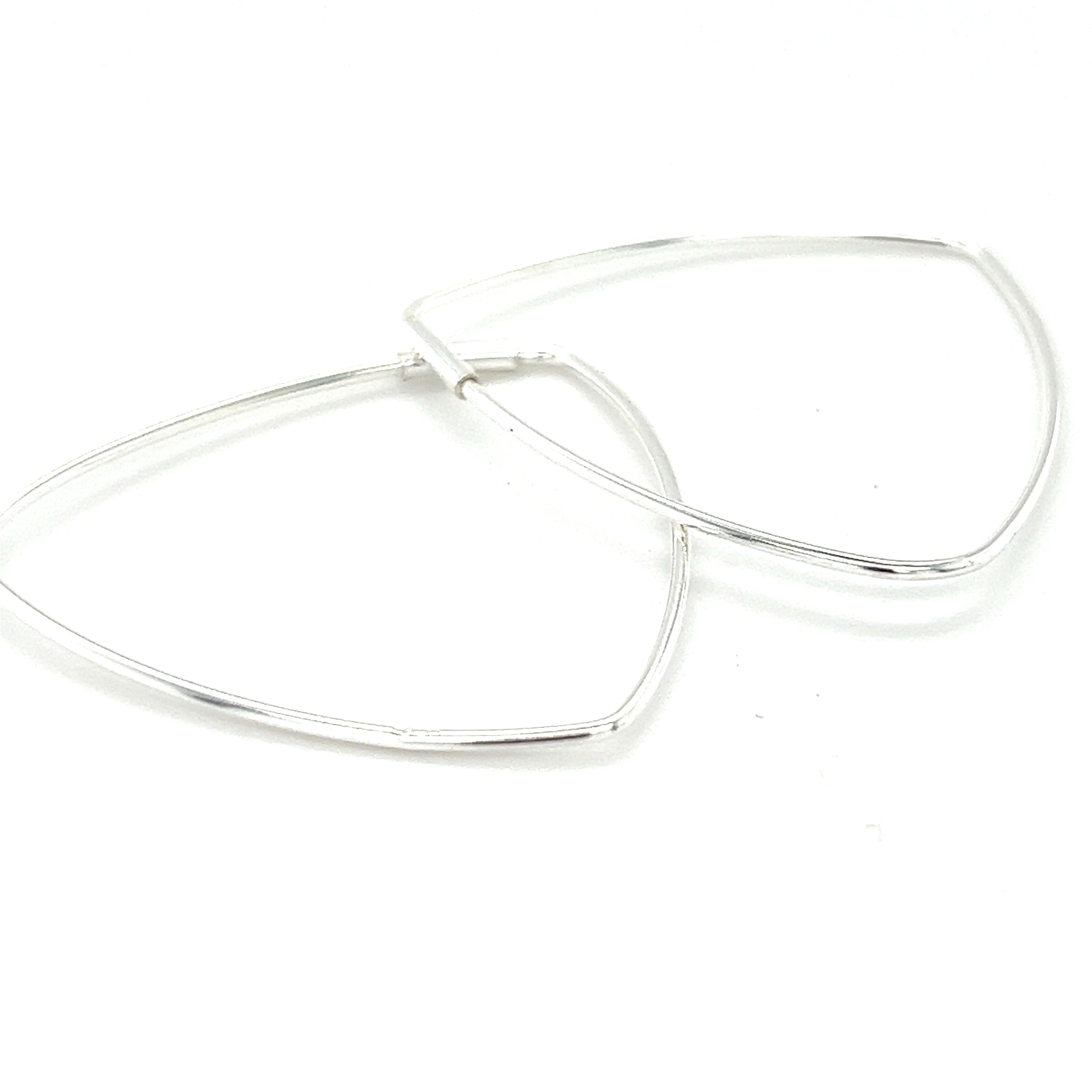 A pair of Delicate Triangle Shaped Hoops by Super Silver on a white background.