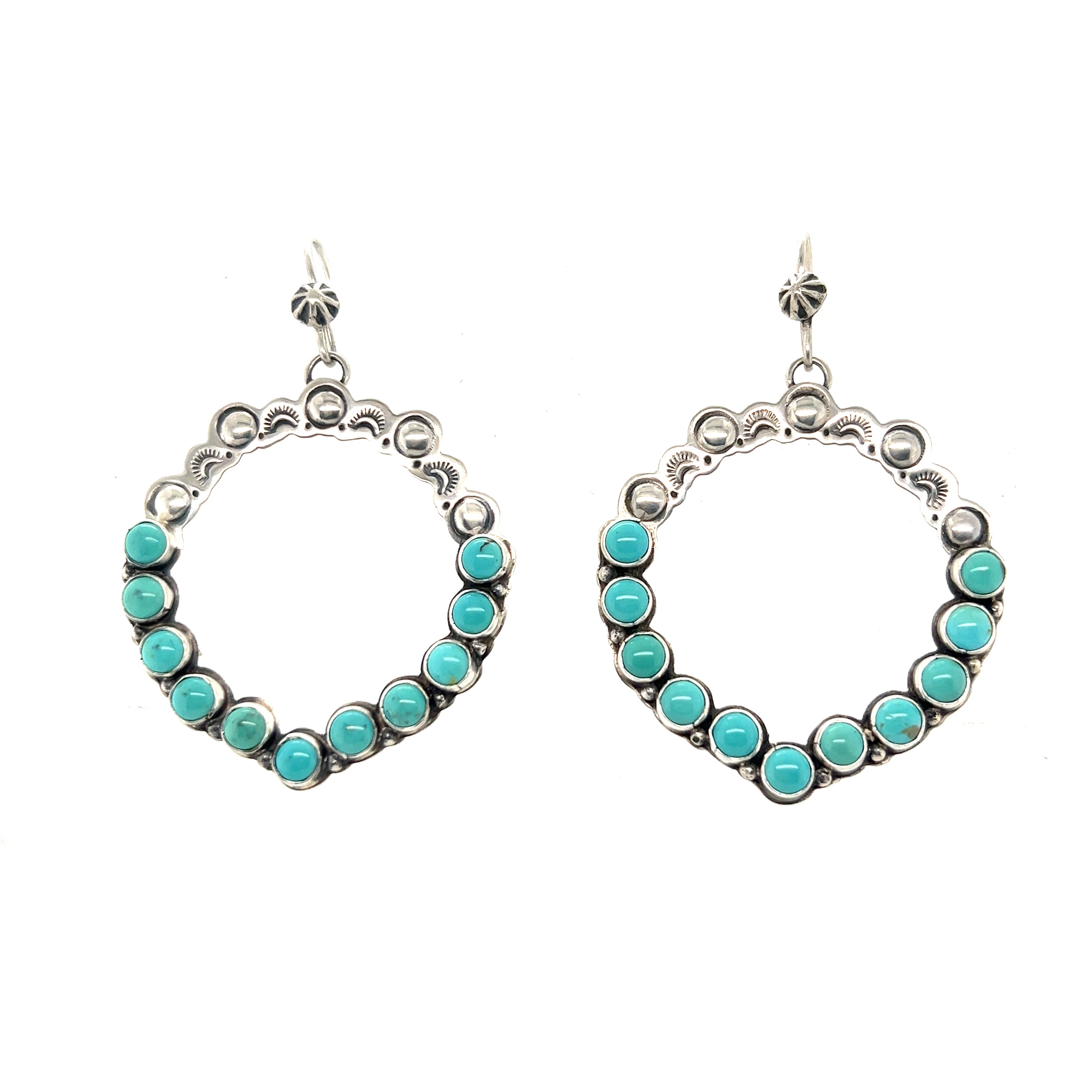 Super Silver's Statement Handmade Turquoise Earrings exude southwestern elegance.