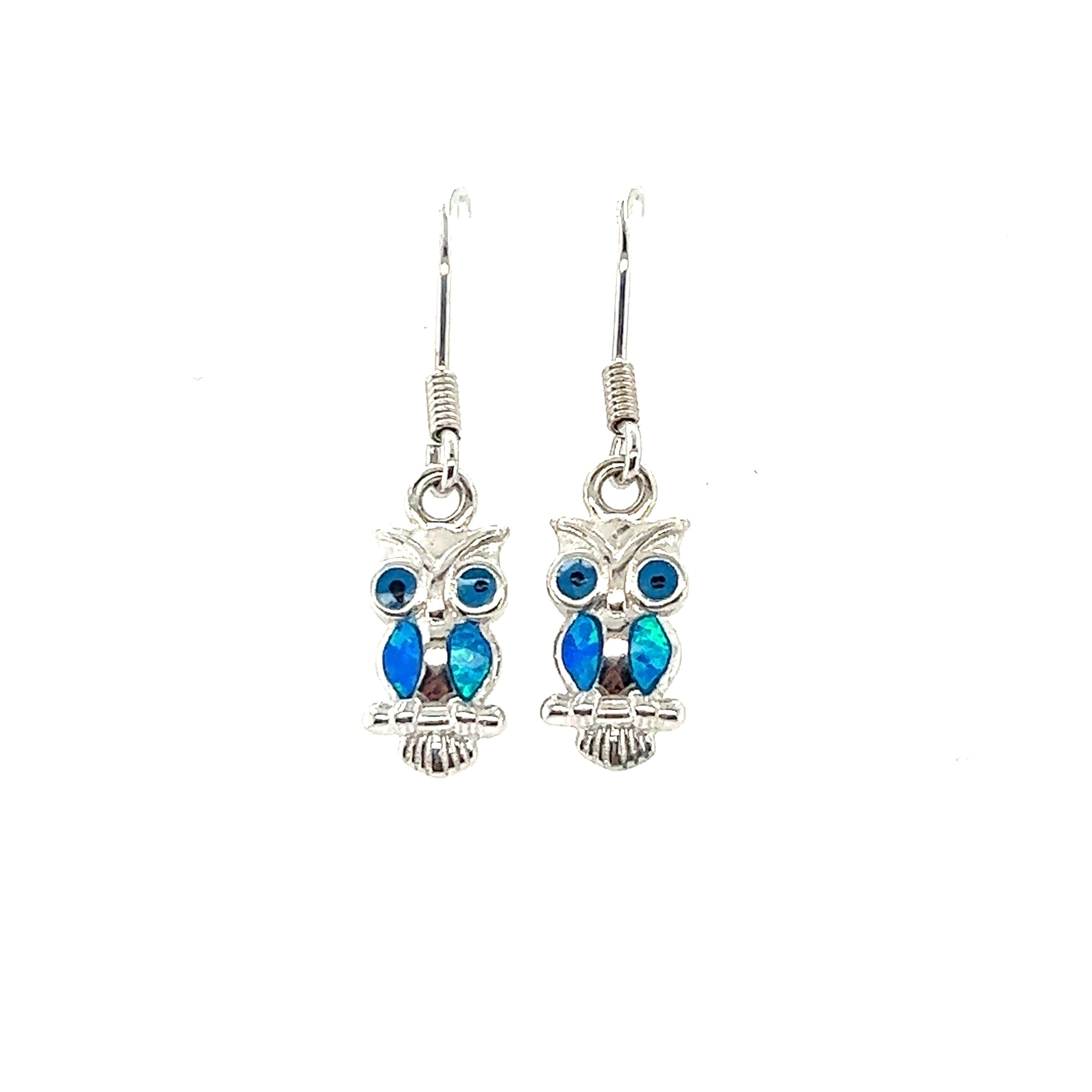 A pair of Lab-Created Opal Owl Earrings, perfect for adding a touch of creativity to your style.