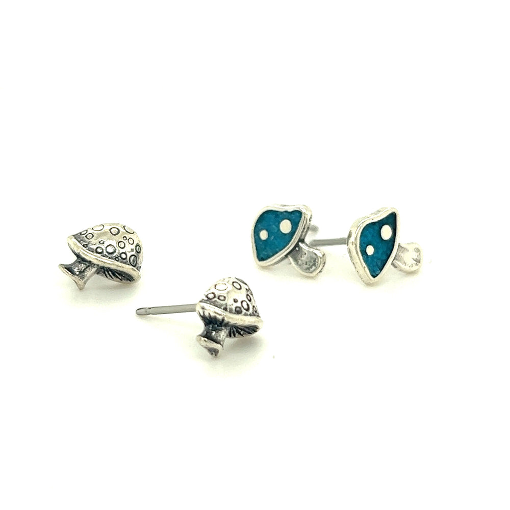 A pair of Mushroom Stud Earrings accented with Super Silver.