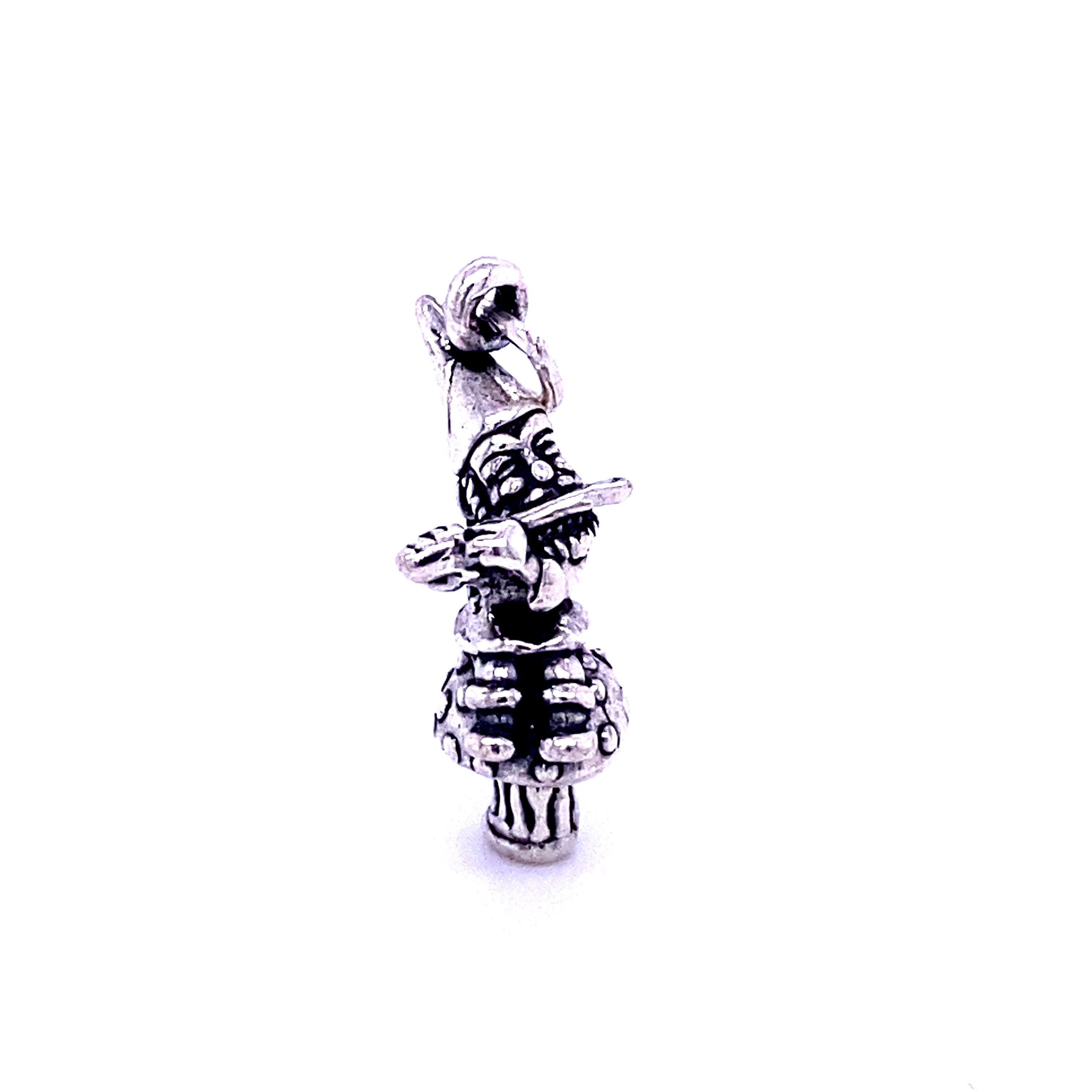 A Mystical Mushroom charm with a skull and crossbones on it by Super Silver.