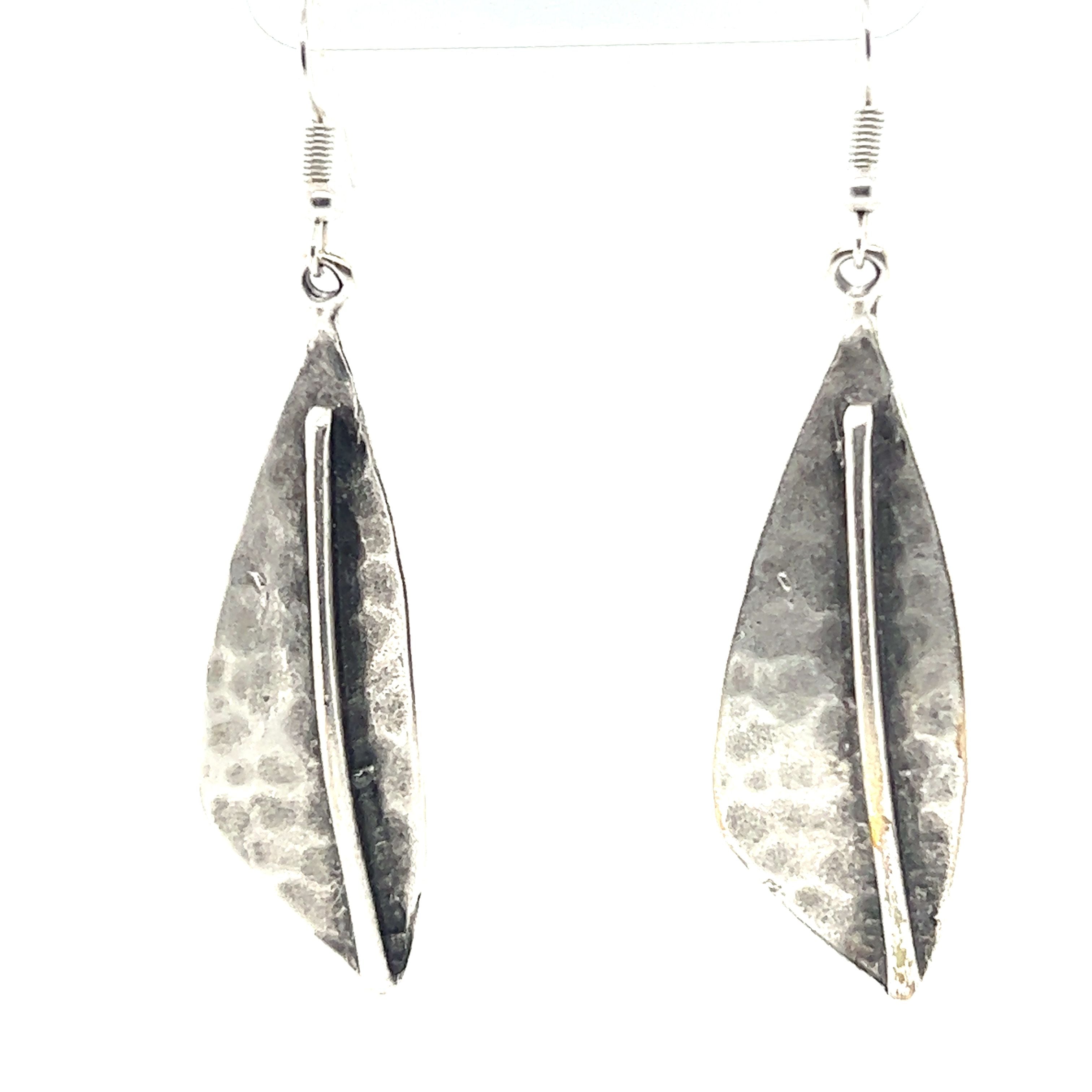 A pair of triangular Boho Statement earrings from Super Silver on a white background.