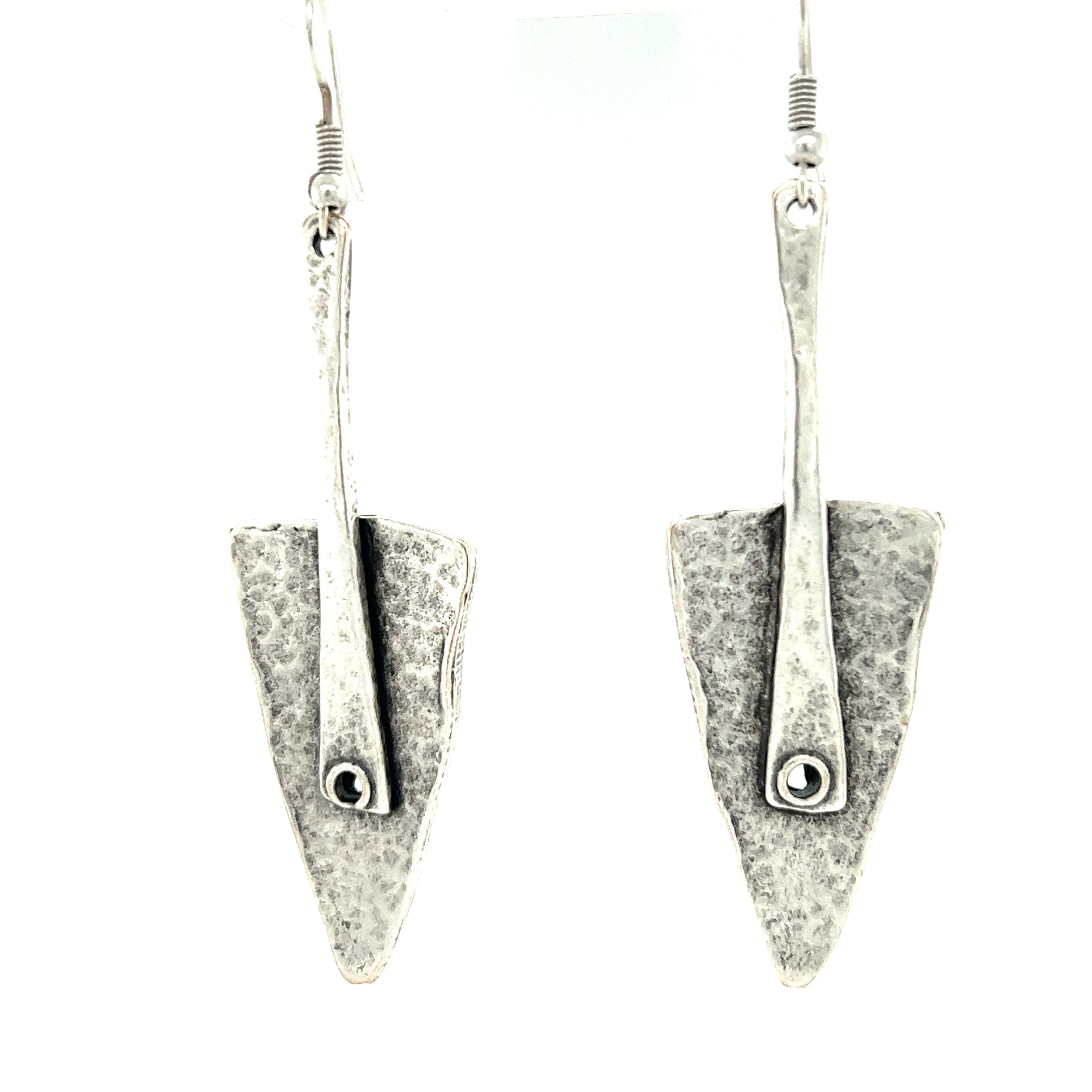 A pair of silver Super Silver Triangular Boho Statement Earrings, perfect for adding a touch of boho-chic to your urban boho jewelry collection.