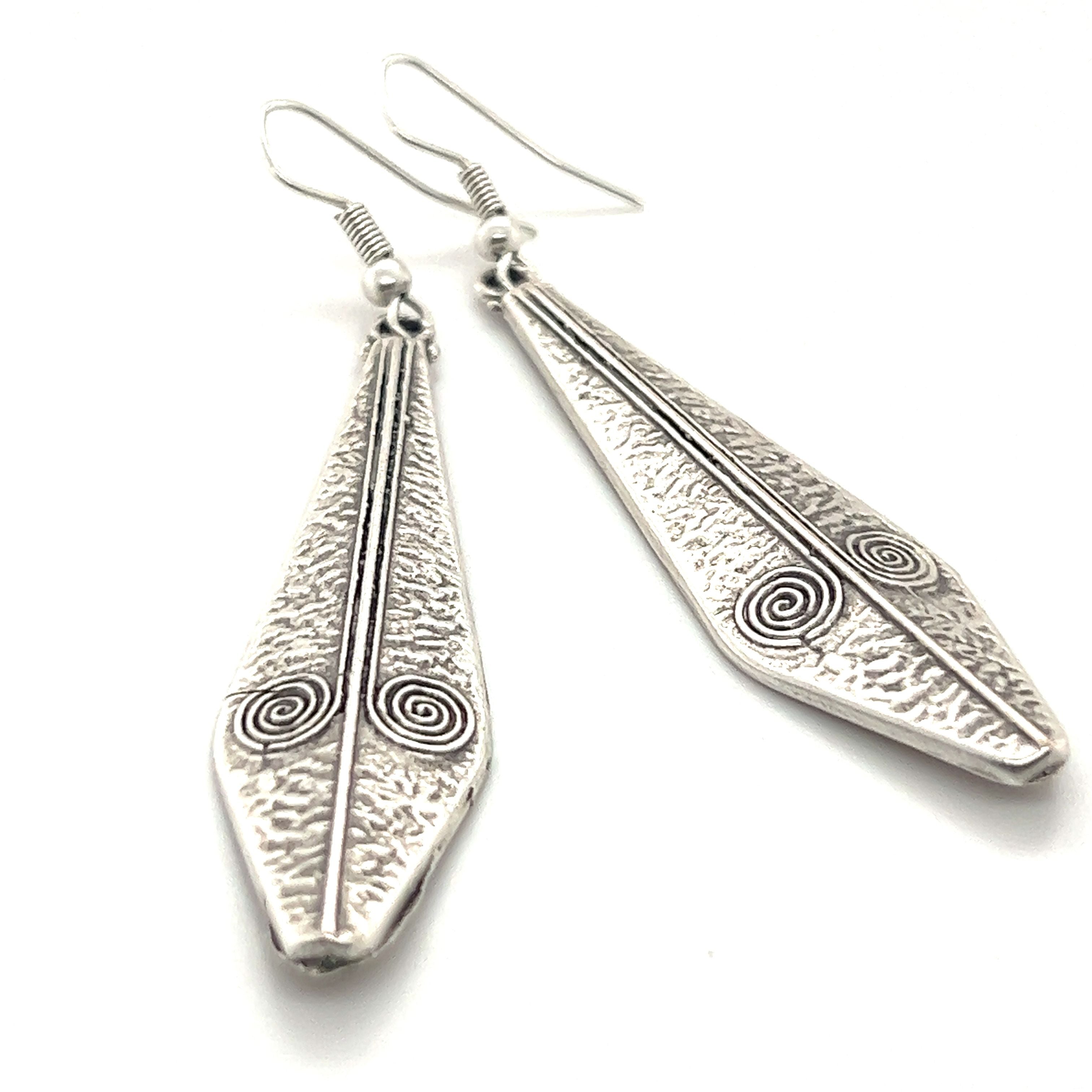 A pair of Triangular Boho Statement Earrings by Super Silver, with intricate designs, crafted from Zamak.