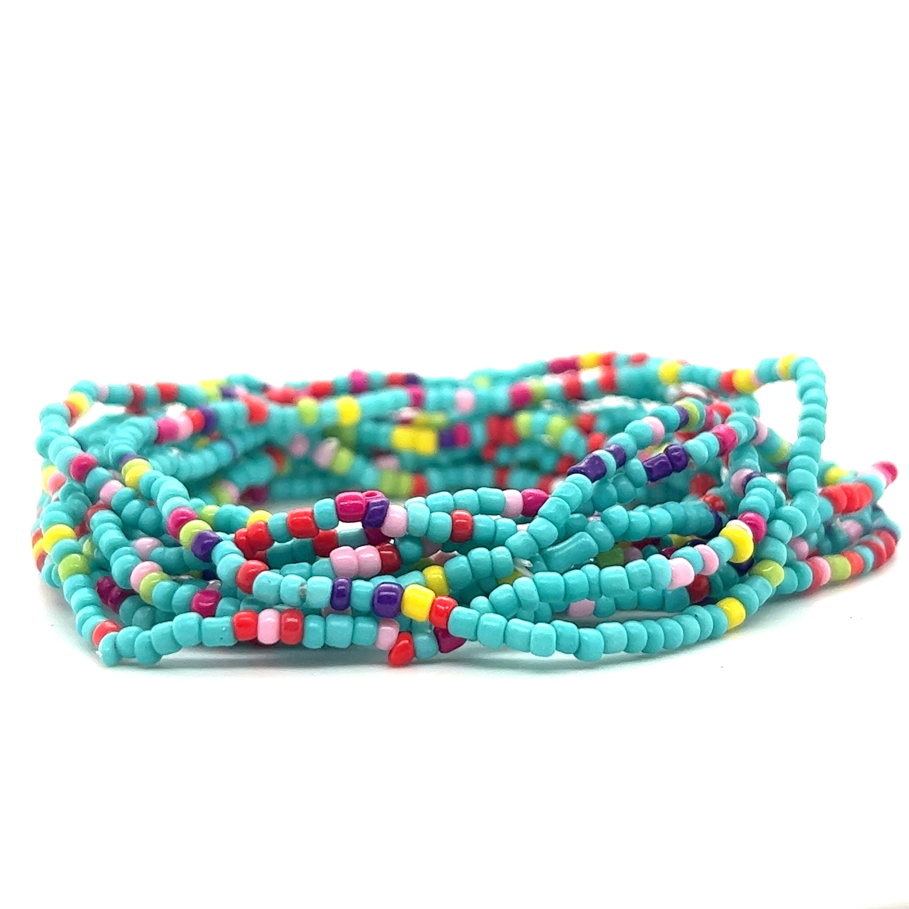 A stack of Super Silver Dainty Beaded Bracelets on a white background.