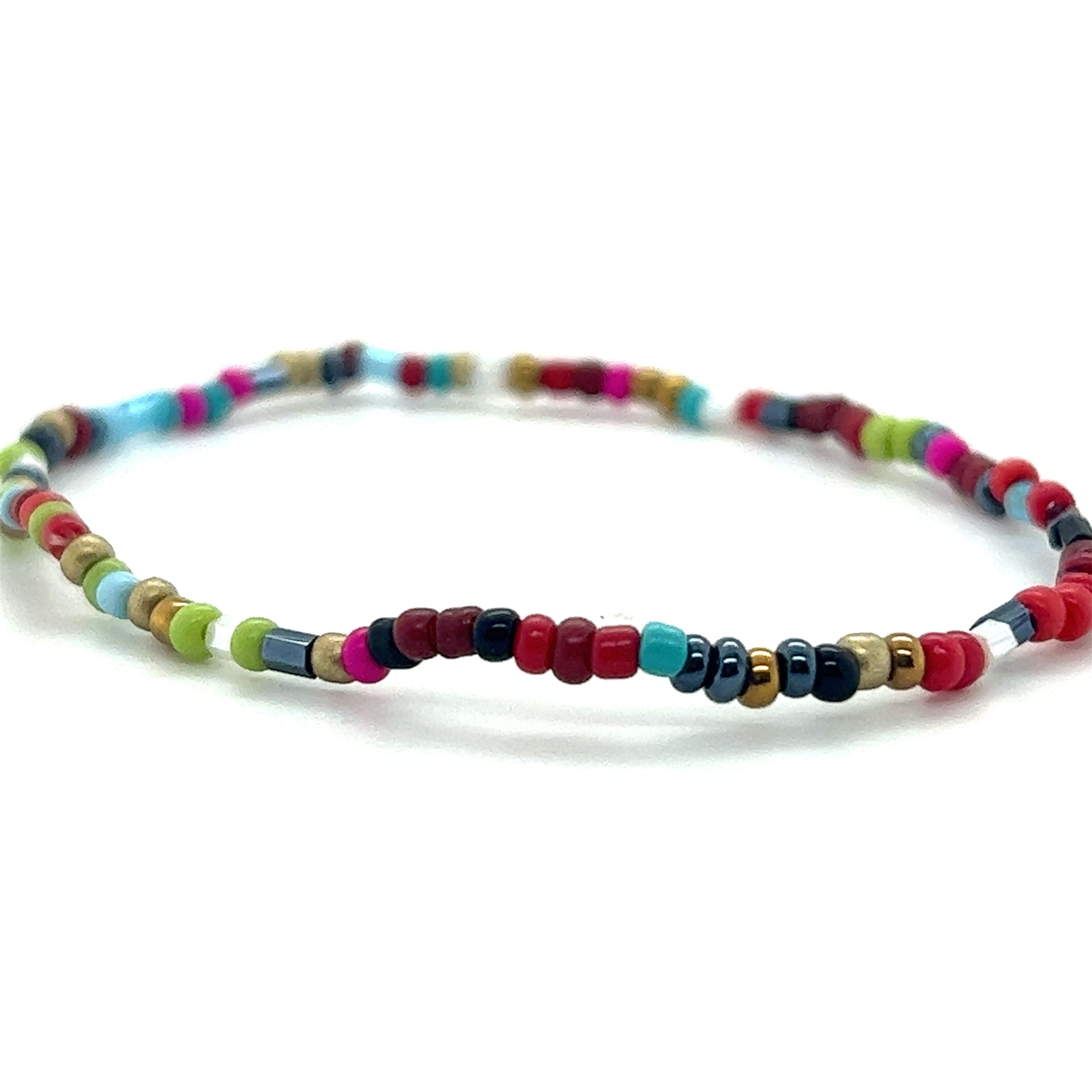 A Super Silver Dainty Beaded Bracelet with vibrant colors on a white background.