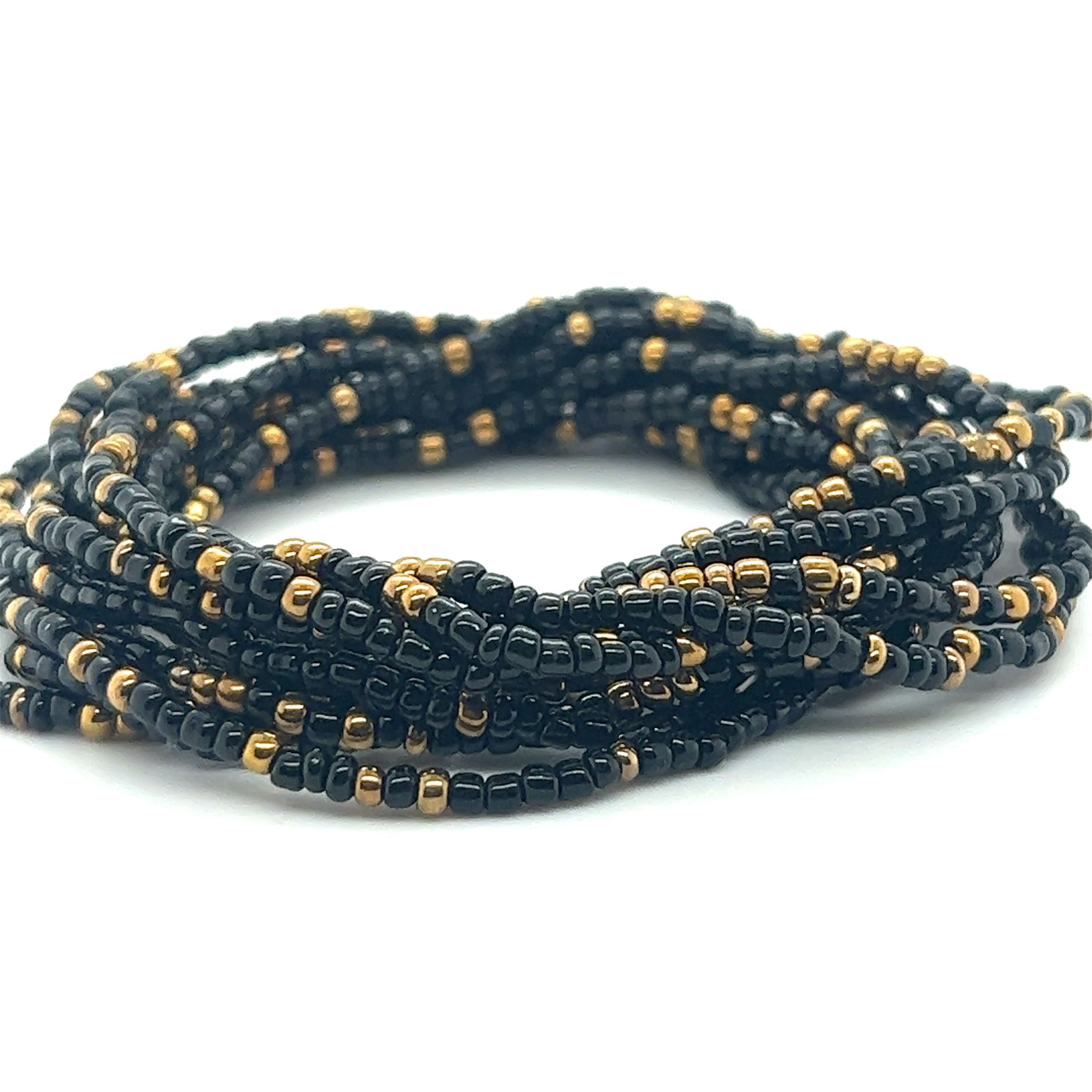A Super Silver Dainty Beaded Bracelet in black and gold.
