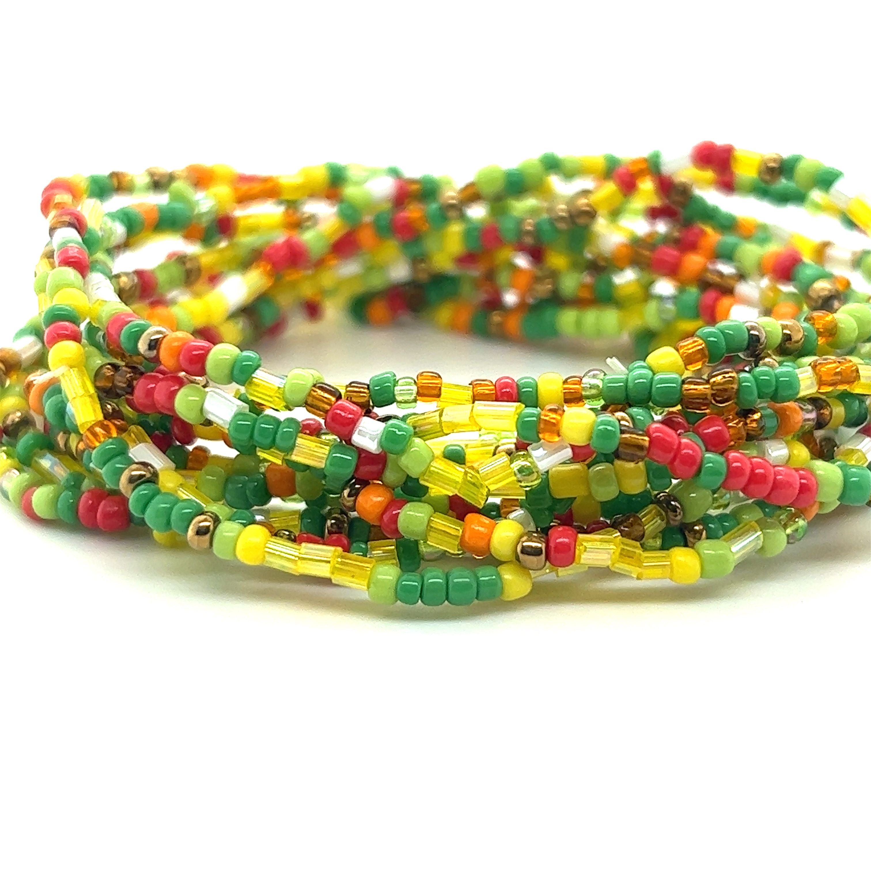 A stack of Dainty Beaded Bracelets in vibrant colors on a white background by Super Silver.