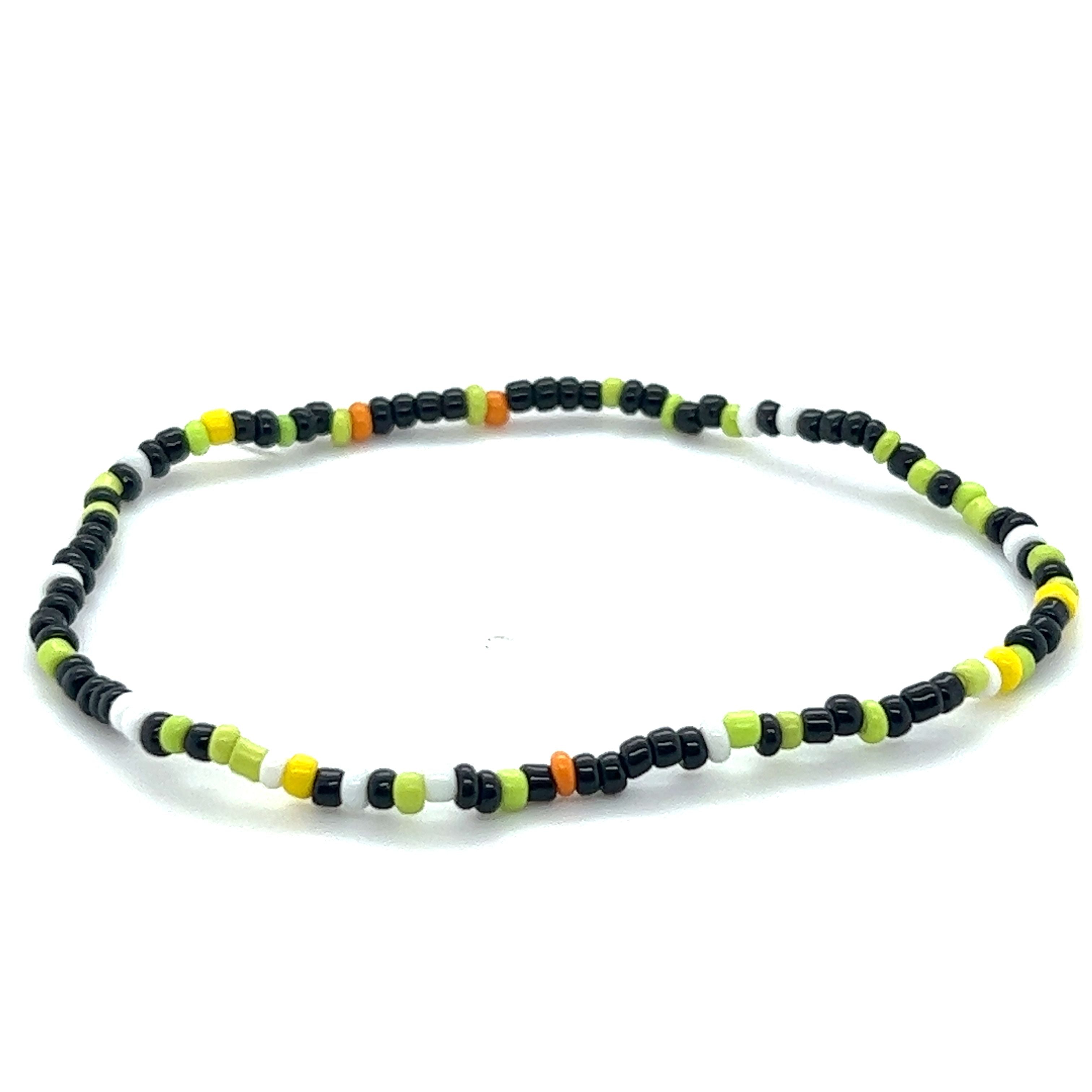 A Super Silver Dainty Beaded Bracelet with black and orange seed beads on a white background.