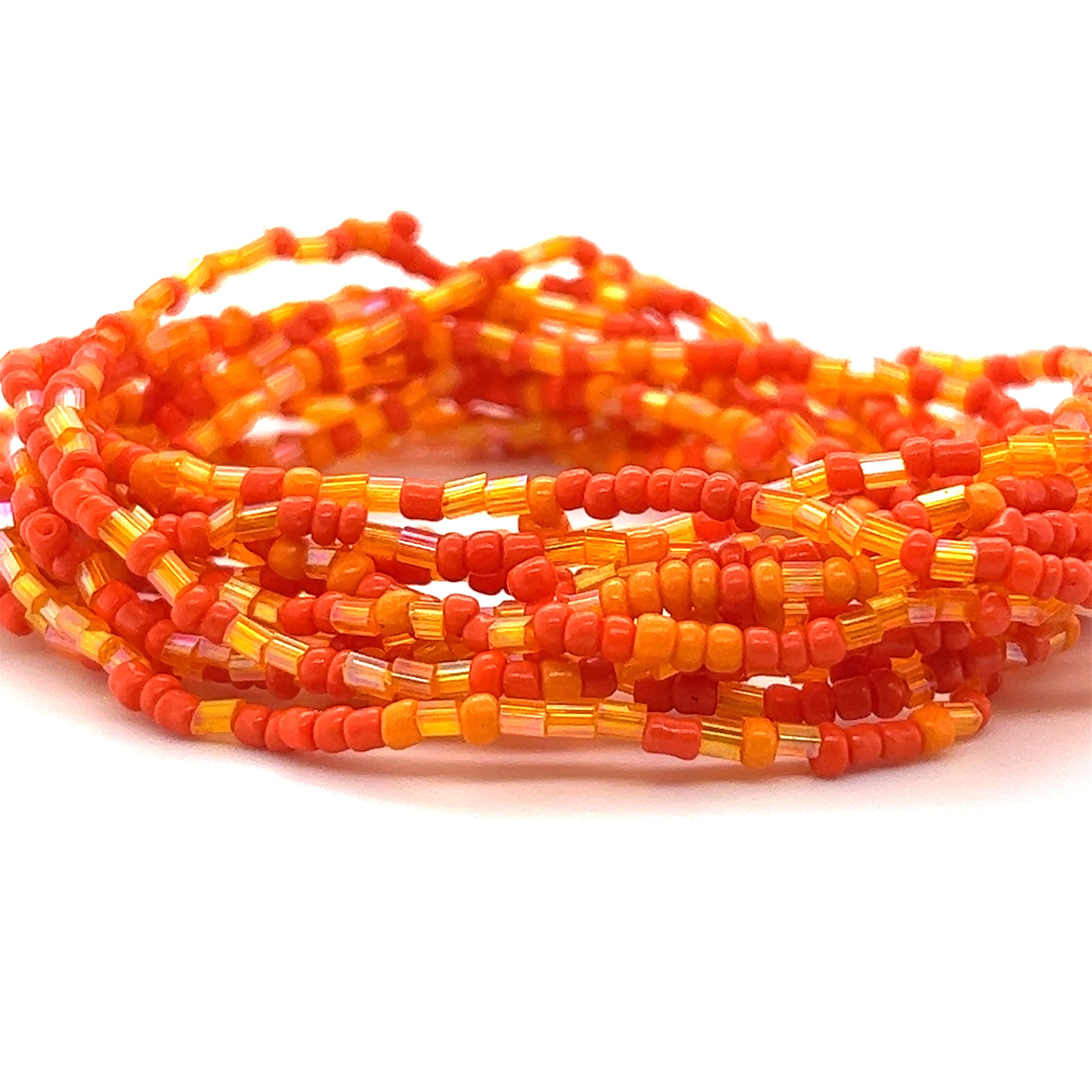 A stack of Super Silver Dainty Beaded Bracelets on a white background.