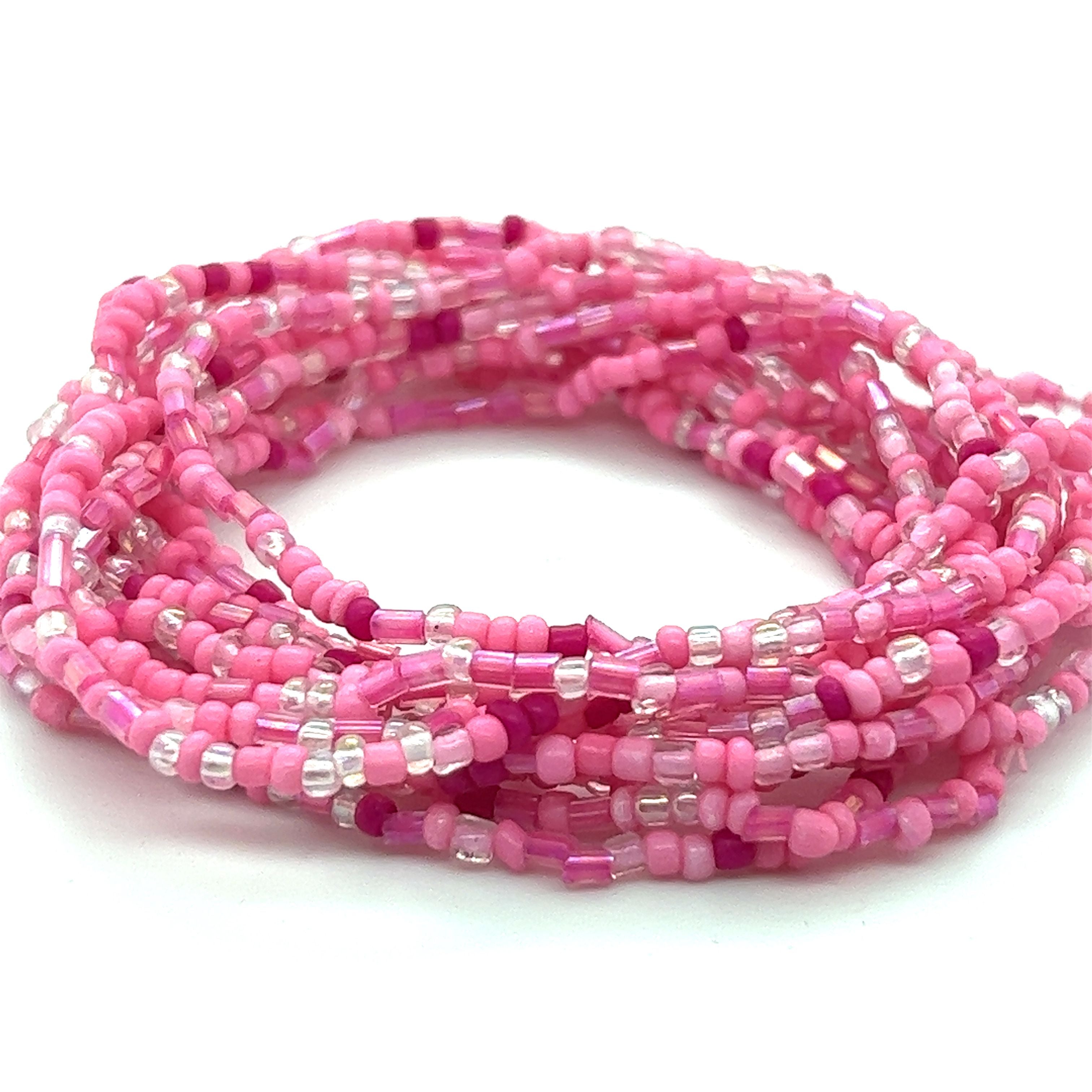 A Super Silver Dainty Beaded Bracelet with pink and silver colors on a white background.