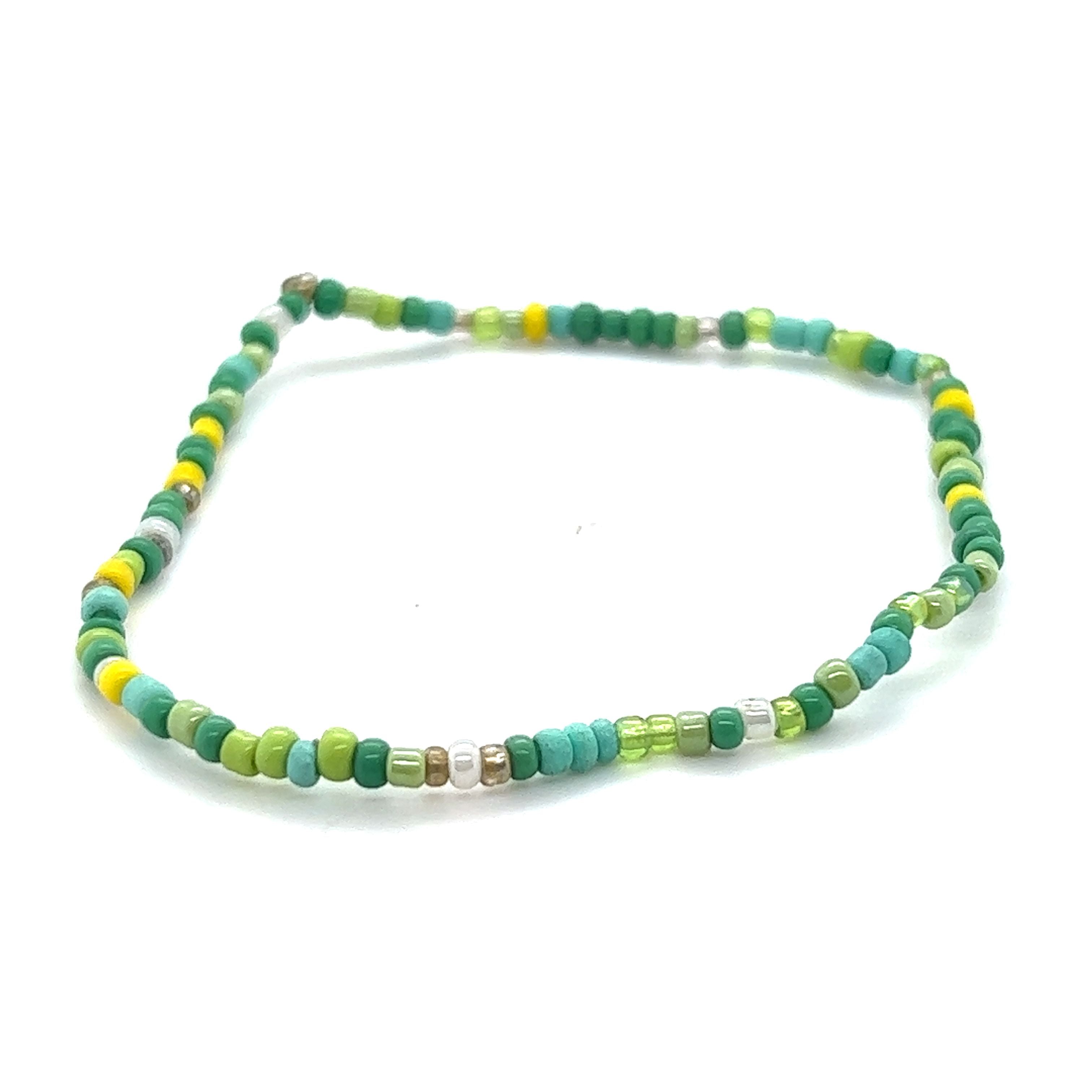 A Super Silver Dainty Beaded Bracelet on a neutral background.