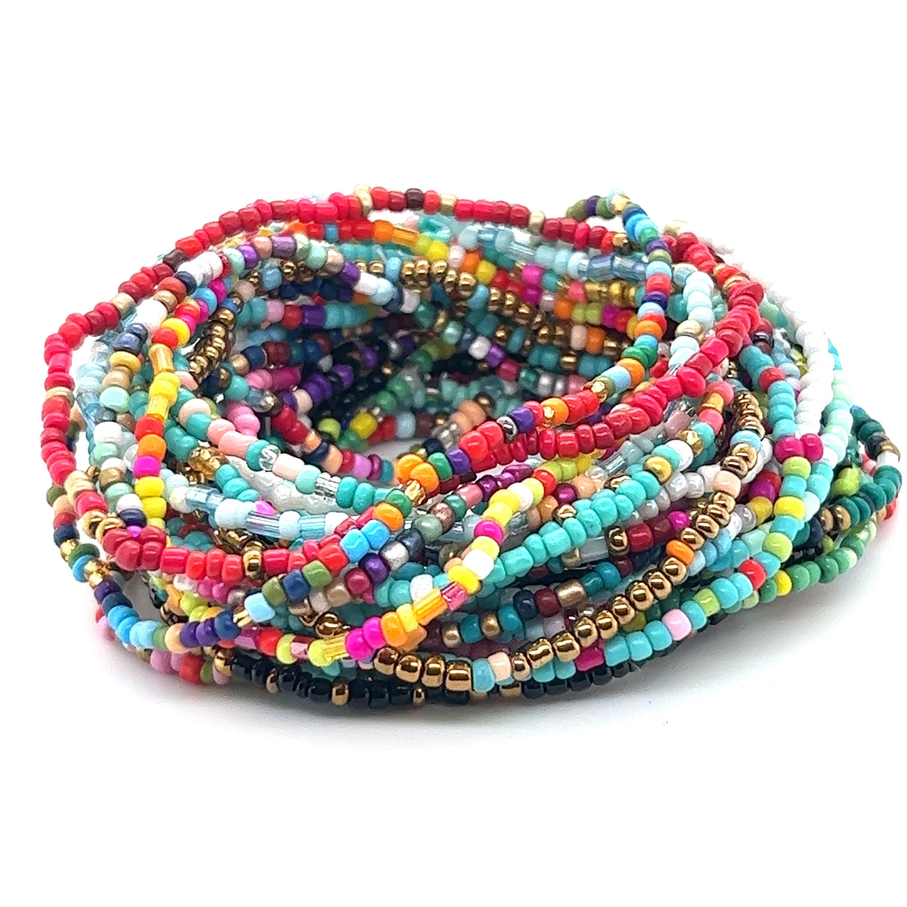 A stack of Super Silver Dainty Beaded Bracelets on a white background.