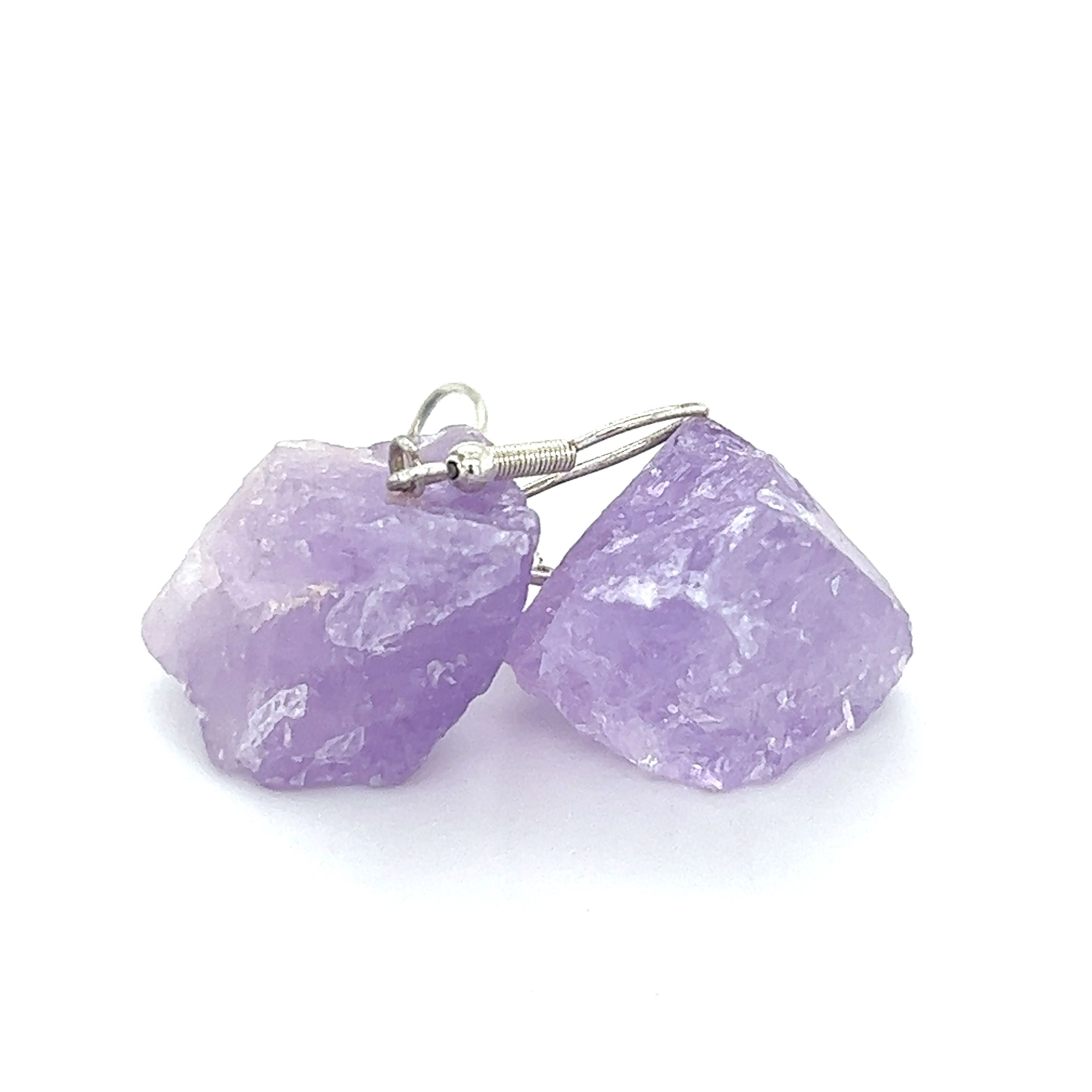 Amethyst dangle earrings featuring stunning crystal accents. These eye-catching Raw Crystal Earrings by Super Silver are the perfect choice for anyone seeking a touch of elegance and vibrance. Pair them with our exquisite black tourmaline earrings for