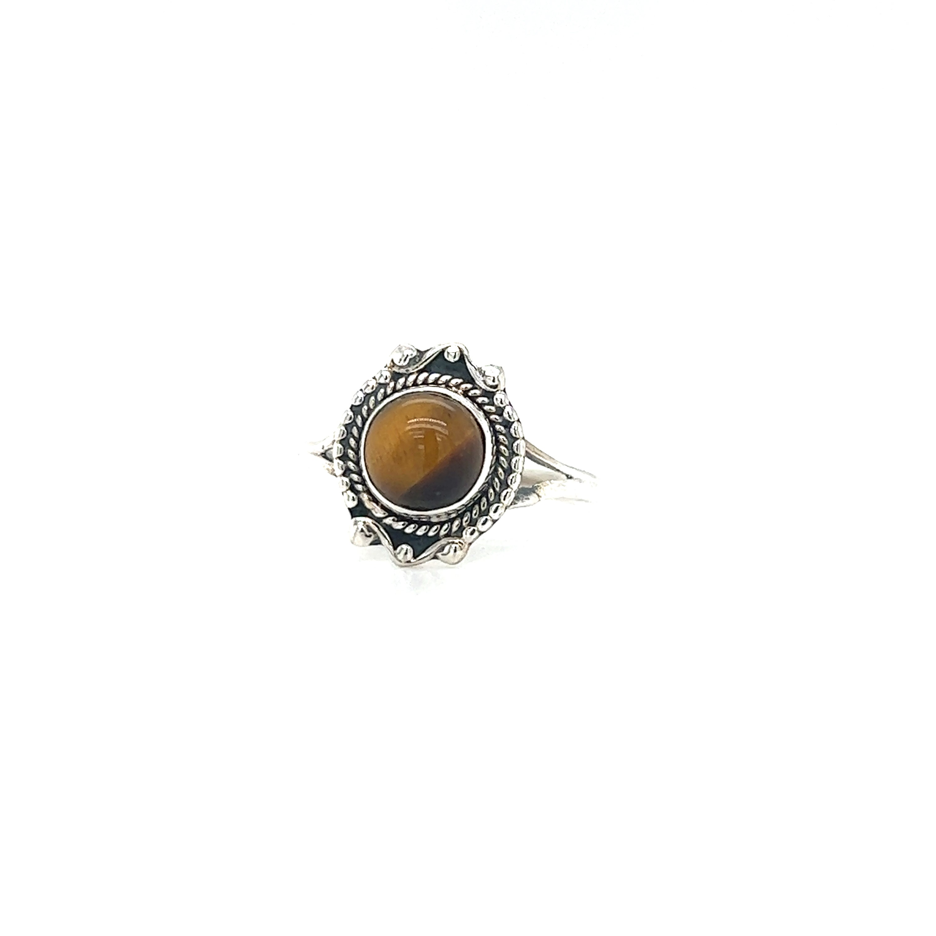 A vintage-style Super Silver Round Gemstone Ring With Vintage Setting, featuring a tiger eye stone, exuding bohemian sophistication.