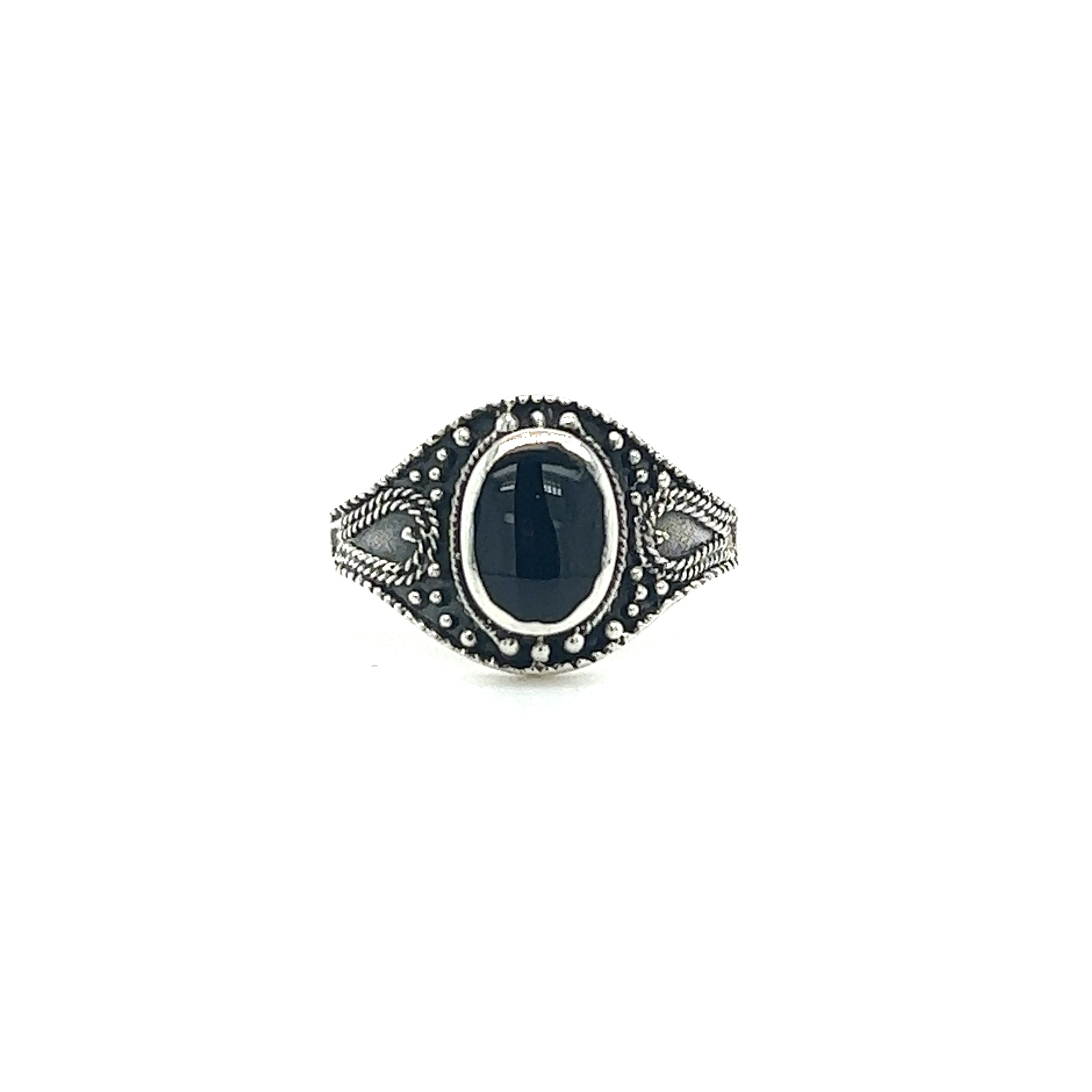 A Vintage Style Oval Shield Ring with Inlaid Stones.