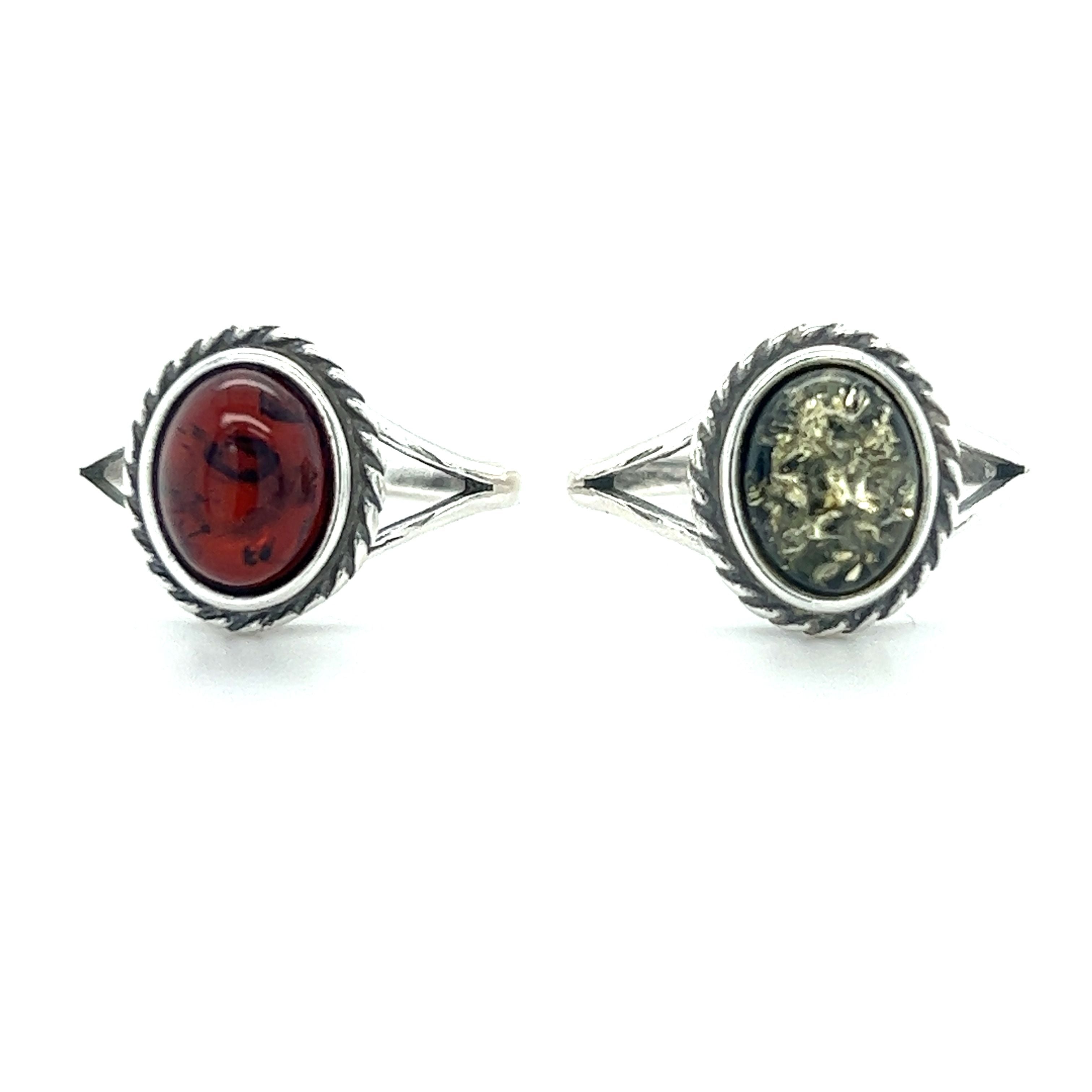 A pair of Super Silver Timeless Baltic Amber Rings with Twisted Border, known for their healing properties and ability to promote mental clarity.