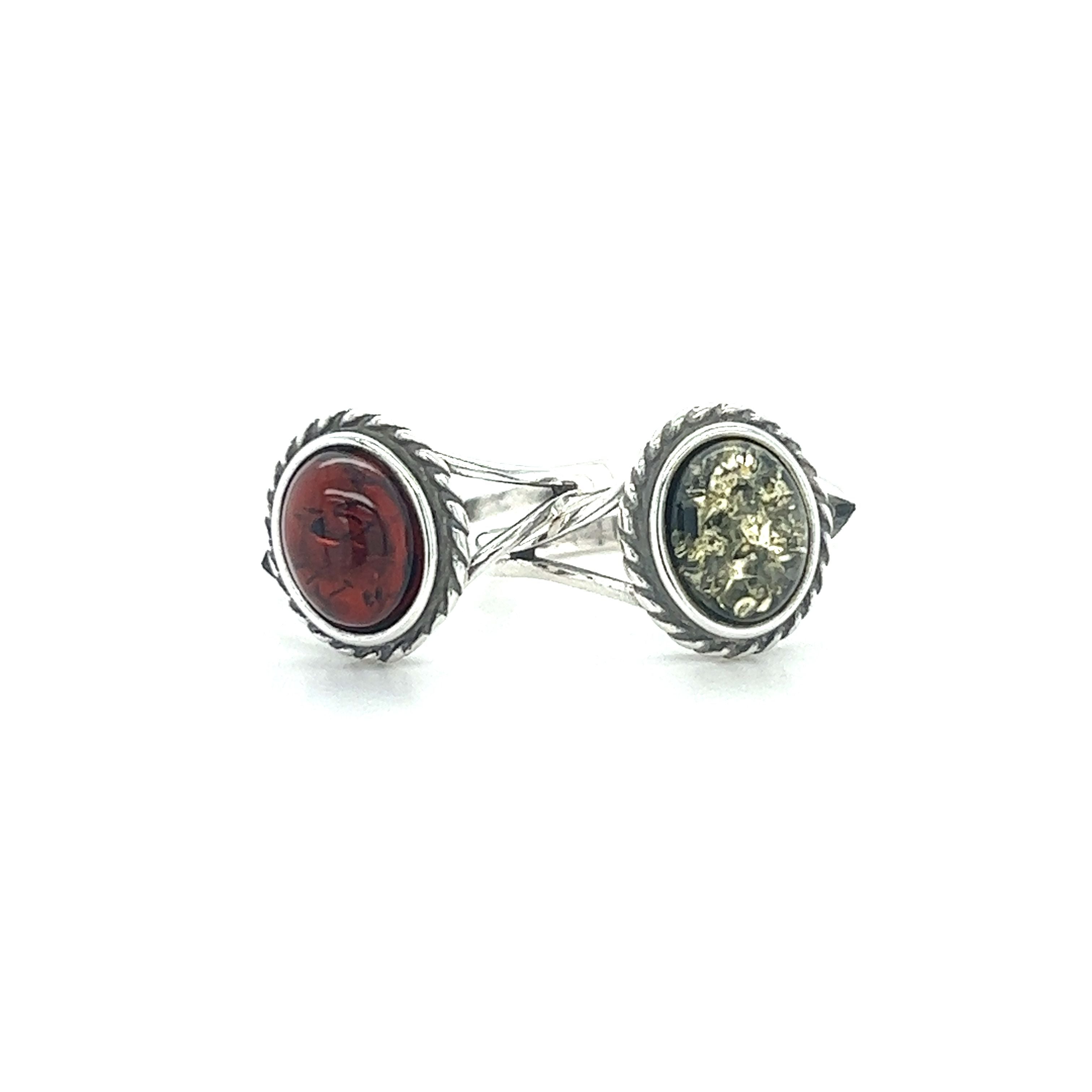 A pair of Super Silver Timeless Baltic Amber Rings with Twisted Border for mental clarity and healing.