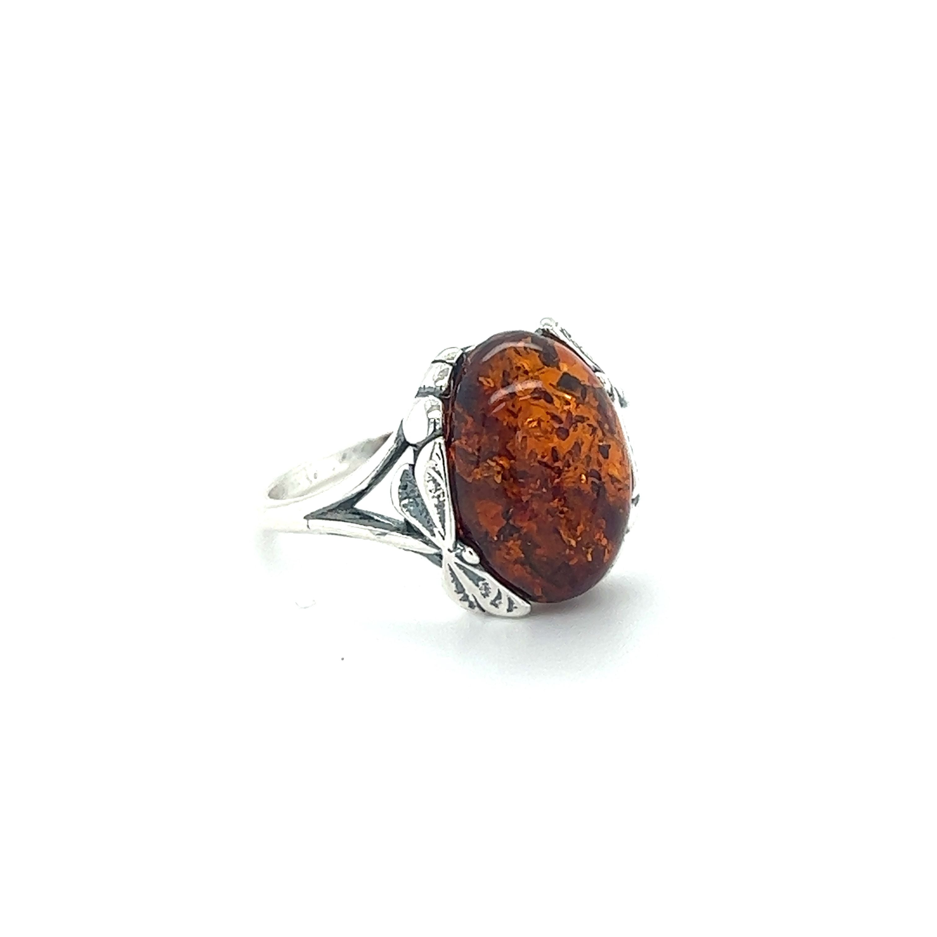 Stunning Dragonfly Band Amber Ring from Super Silver featuring a delicate dragonfly band.