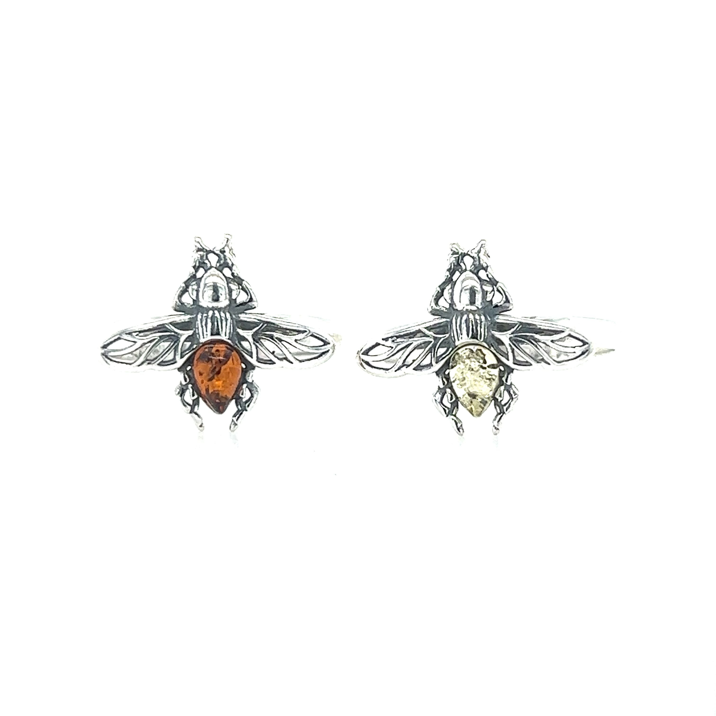 A pair of Detailed Baltic Amber Bee earrings inlaid with amber stones from Super Silver.