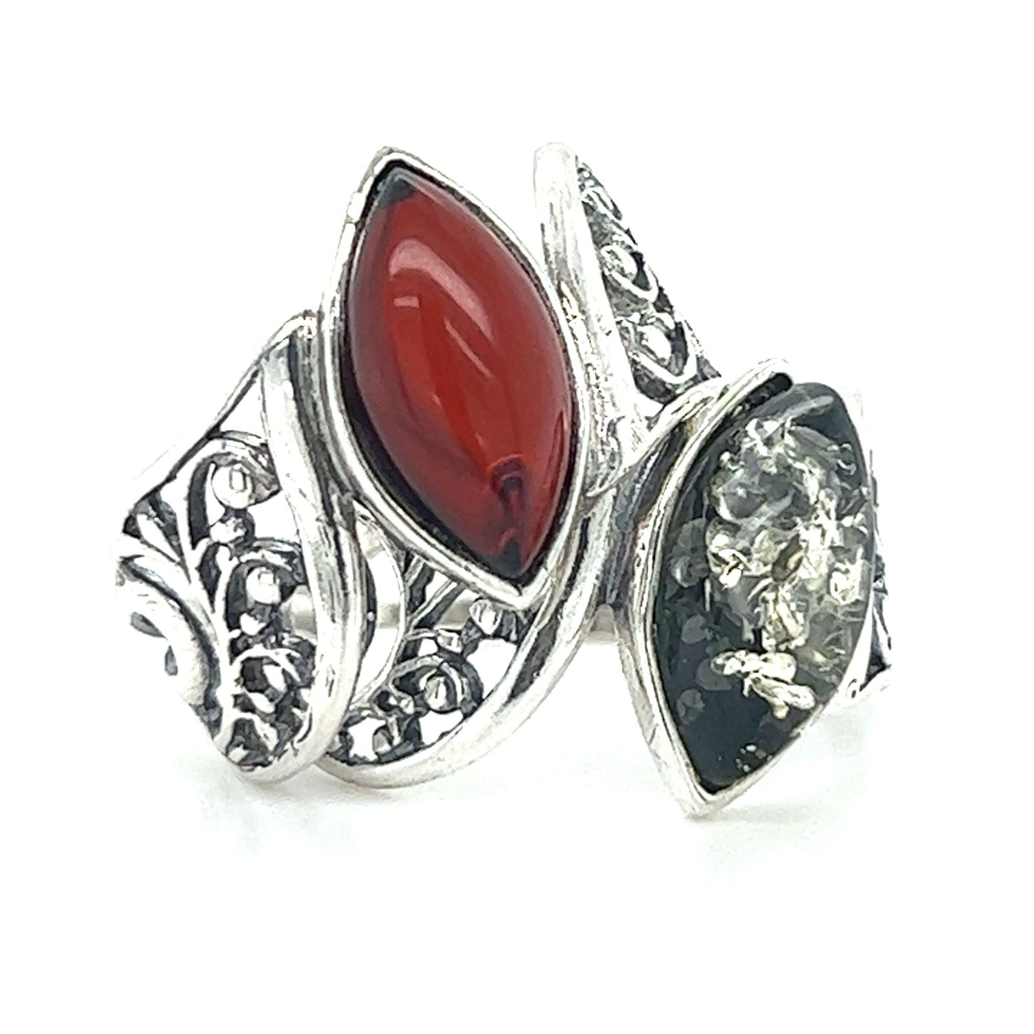 An elegant Super Silver Wide Filigree Band Baltic Amber Ring adorned with exquisite red and black stones.