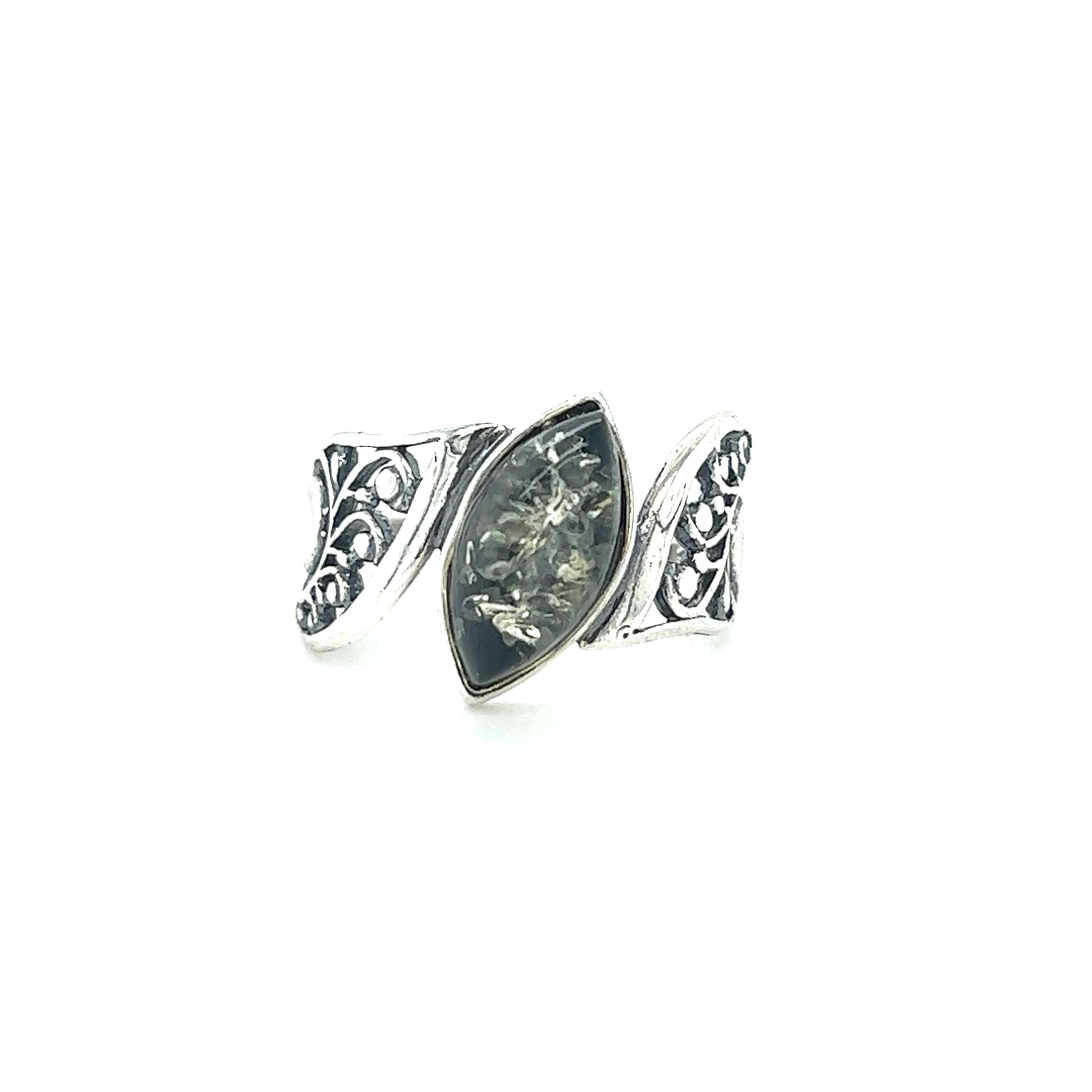 A Wide Filigree Band Baltic Amber Ring with a black stone in the middle by Super Silver.