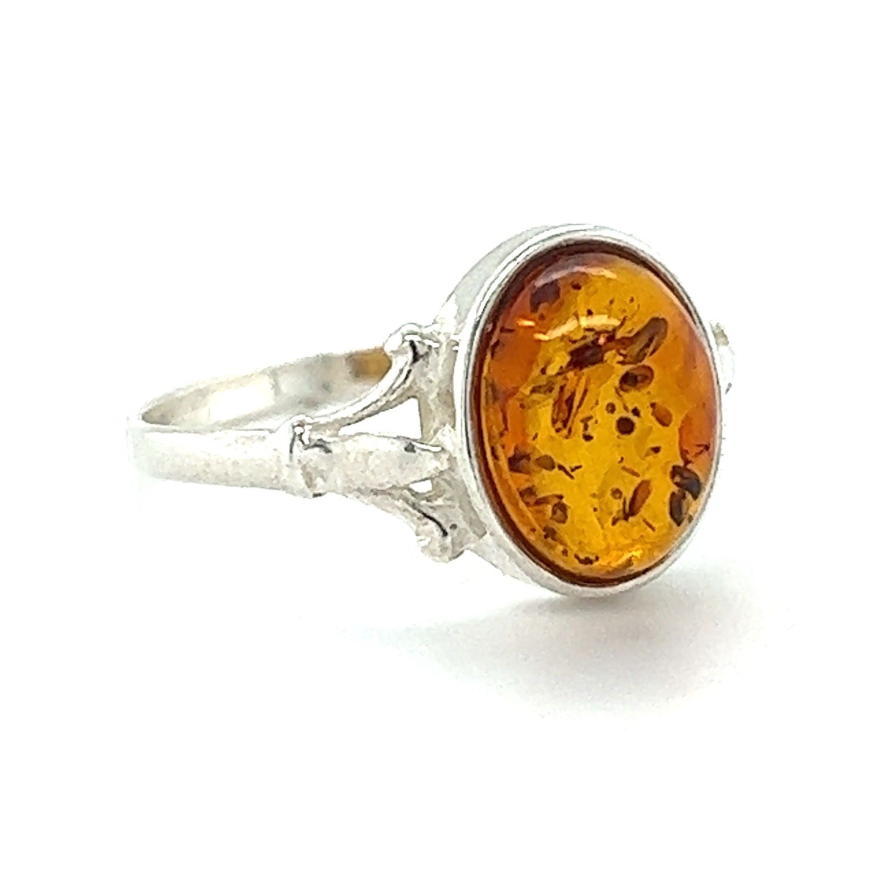A Super Silver Glowing Oval Amber Ring with an oval Baltic amber stone.
