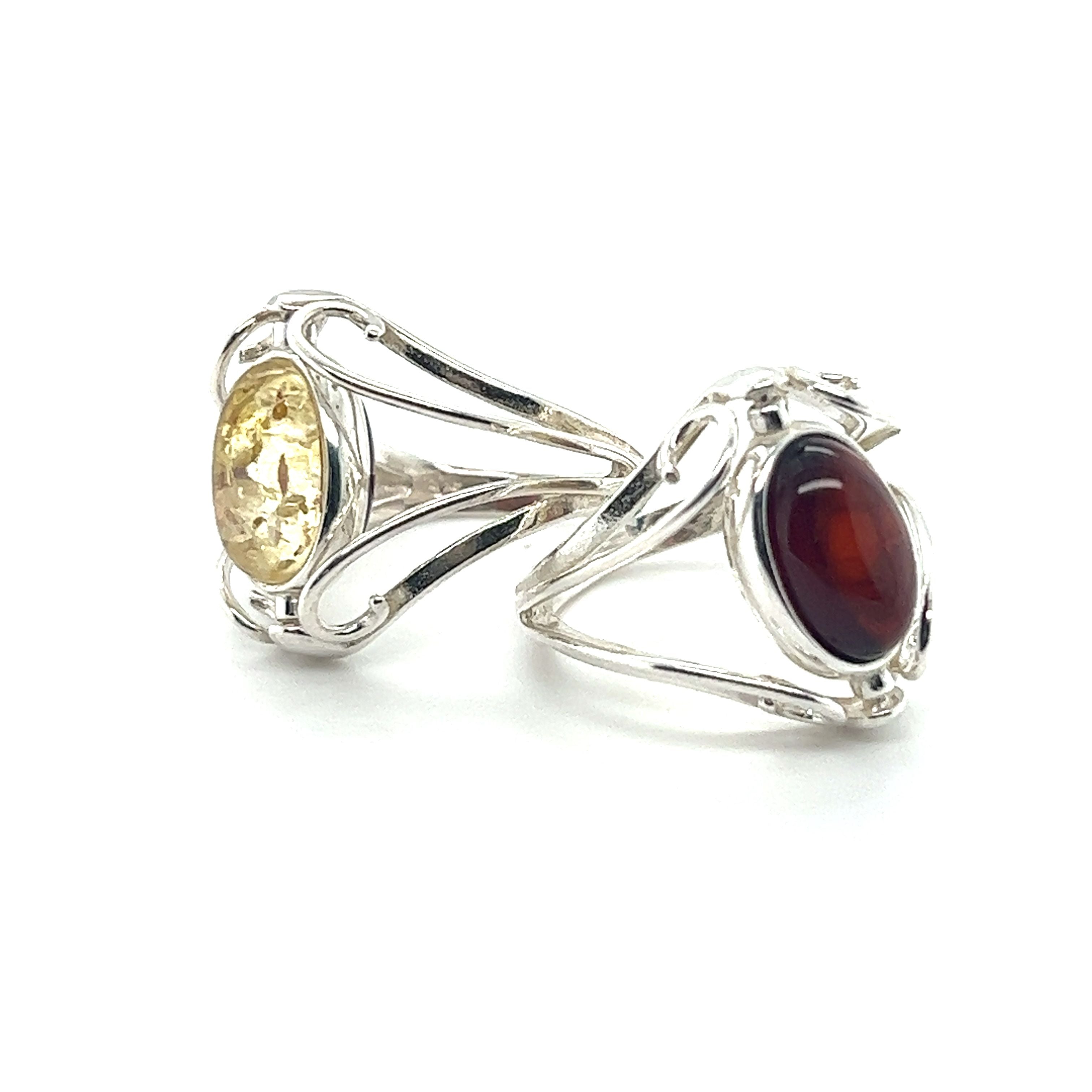 A pair of Super Silver Rotating Lemon and Cherry Amber Rings.