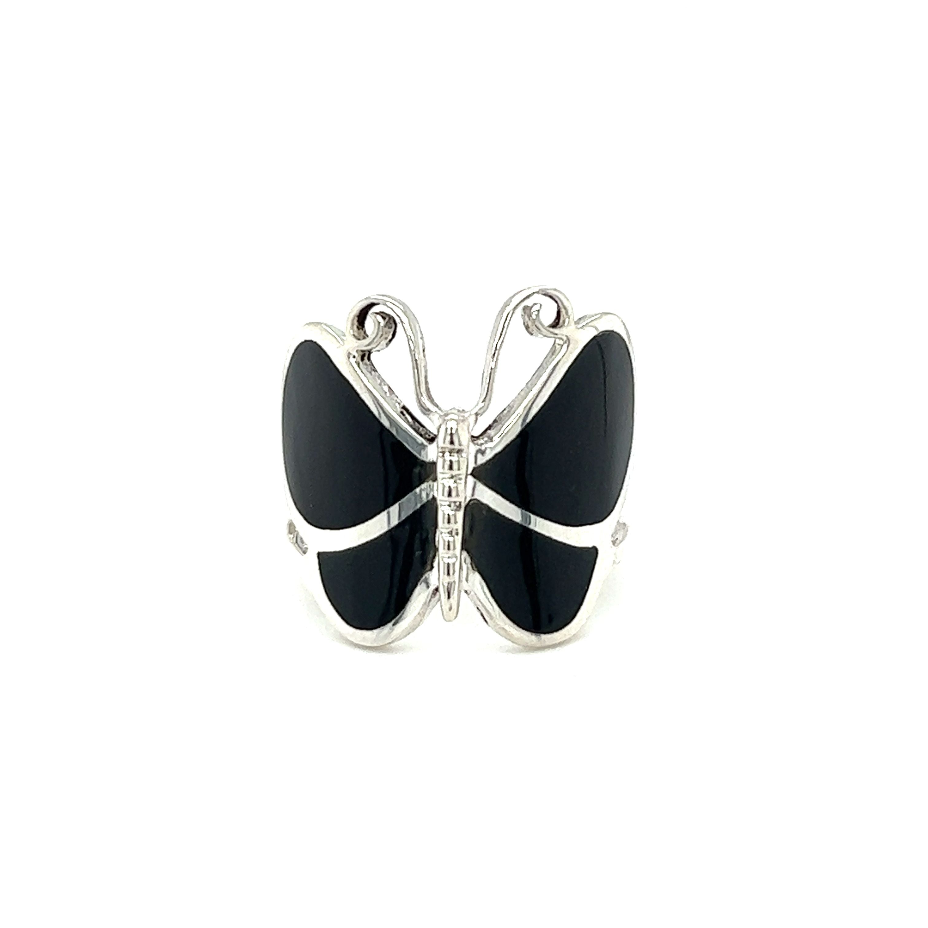 A statement Bold Butterfly Ring with Inlaid Stones and embellished with diamonds.