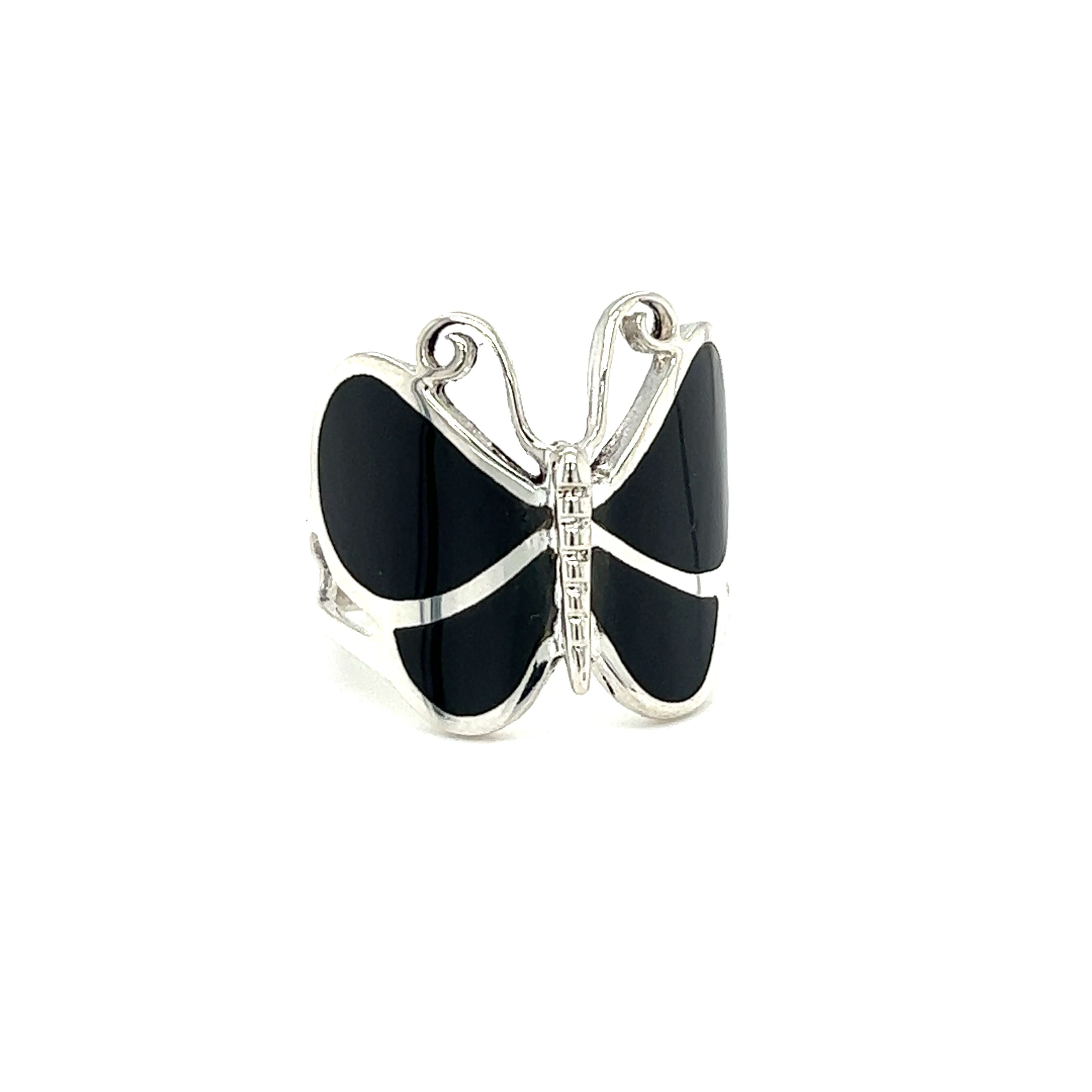 A Super Silver Bold Butterfly Ring with inlaid black onyx and sparkling diamonds, making it a stunning statement piece.