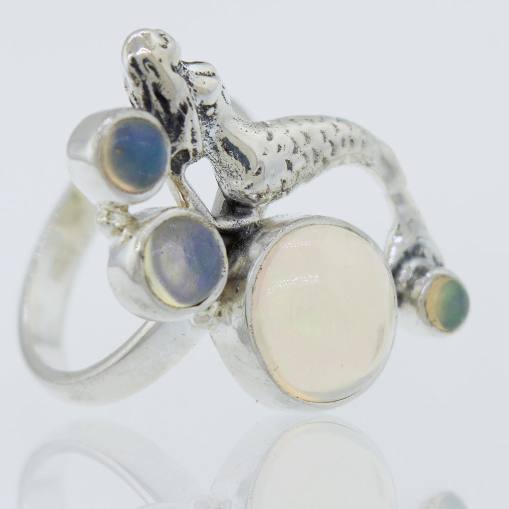 A mythical Mermaid Ring with Ethiopian Opal adorned with a mesmerizing mermaid and captivating Ethiopian opals.