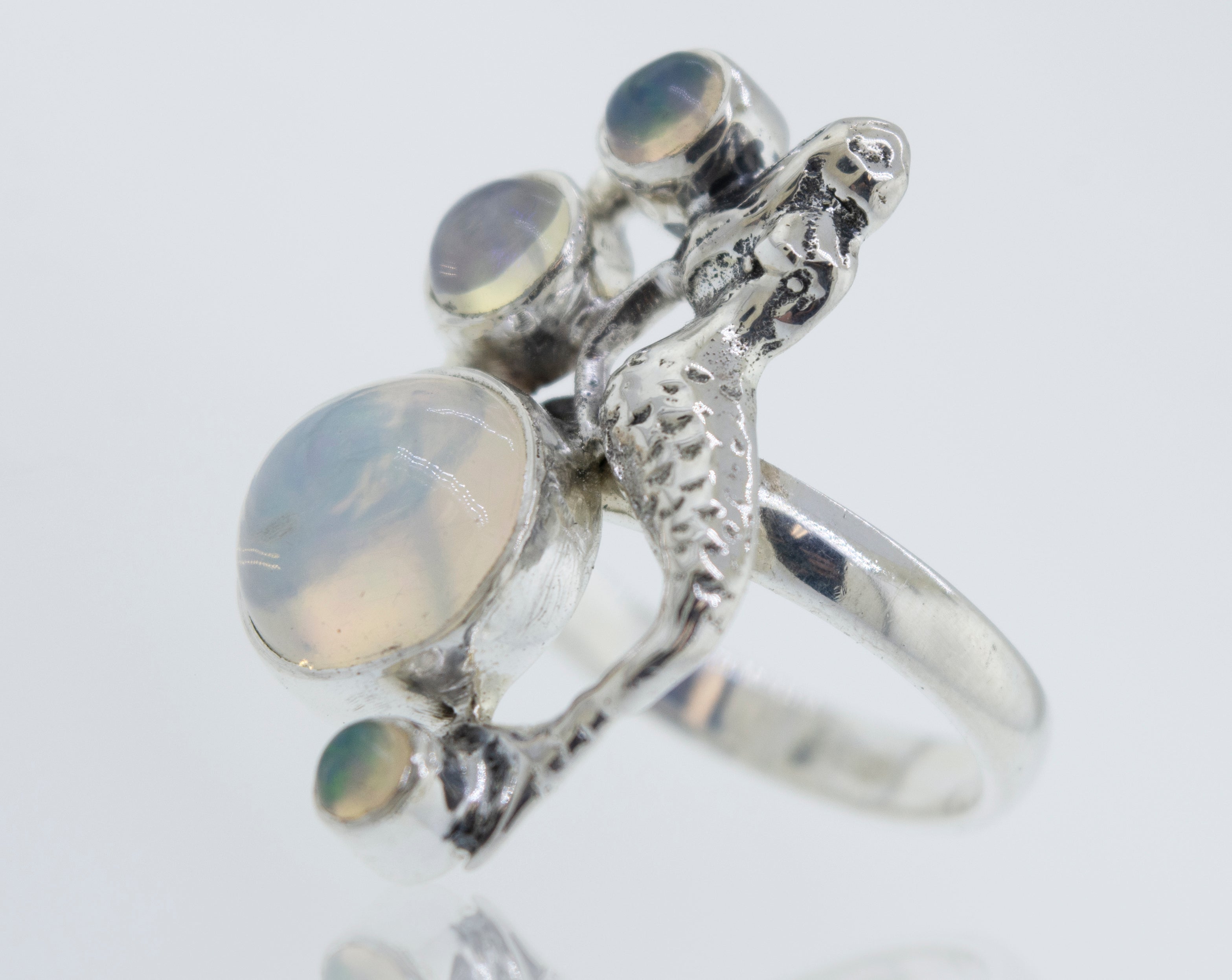 A stunning Mermaid Ring with Ethiopian Opal featuring a mesmerizing mermaid design.