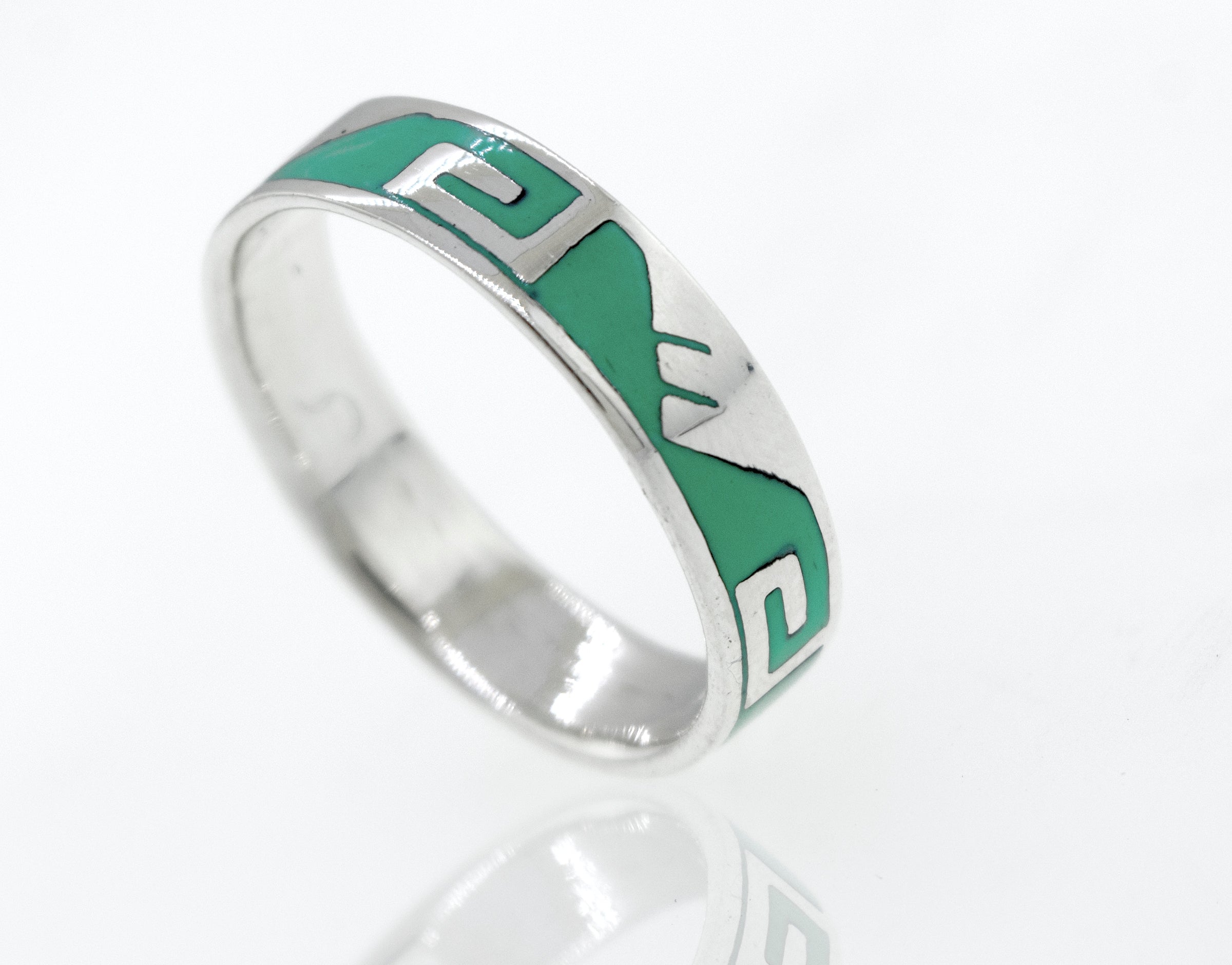 A Greek Wave and Mountain Turquoise Ring with a Super Silver design on it.