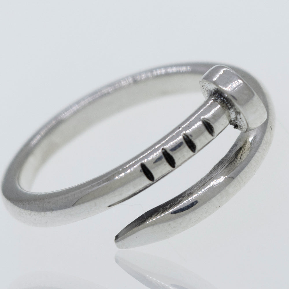 An adjustable Super Silver nail ring with a claw on it.